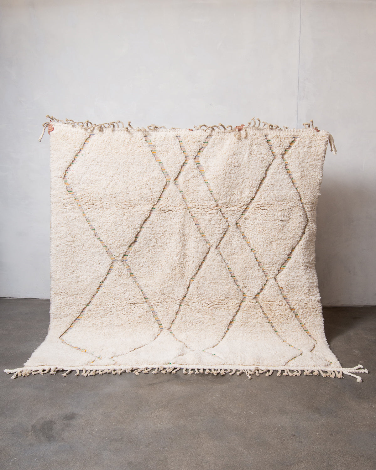 Modern, designer, handcrafted Berber rug from Morocco. Beniourain carpet with minimalist design, natural wool pile and a fluffy texture.