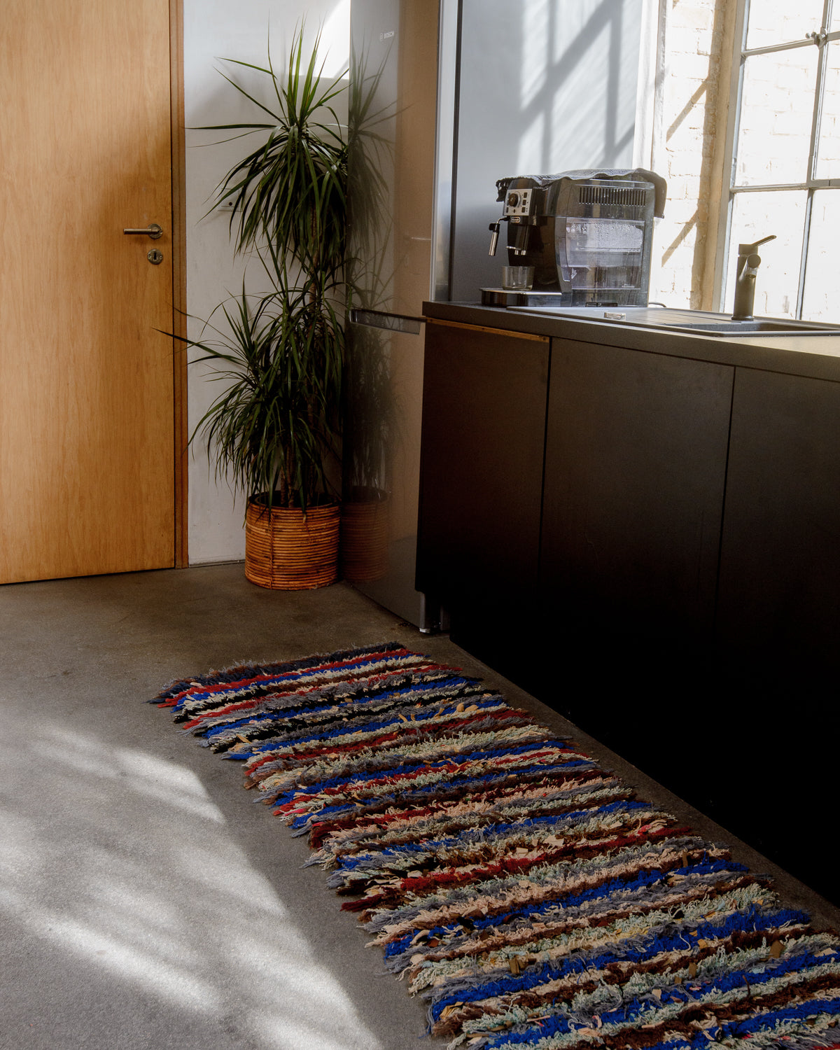 Modern designer vintage handcrafted Berber rug from Morocco. Boucherouite with beautiful colors and patterns.