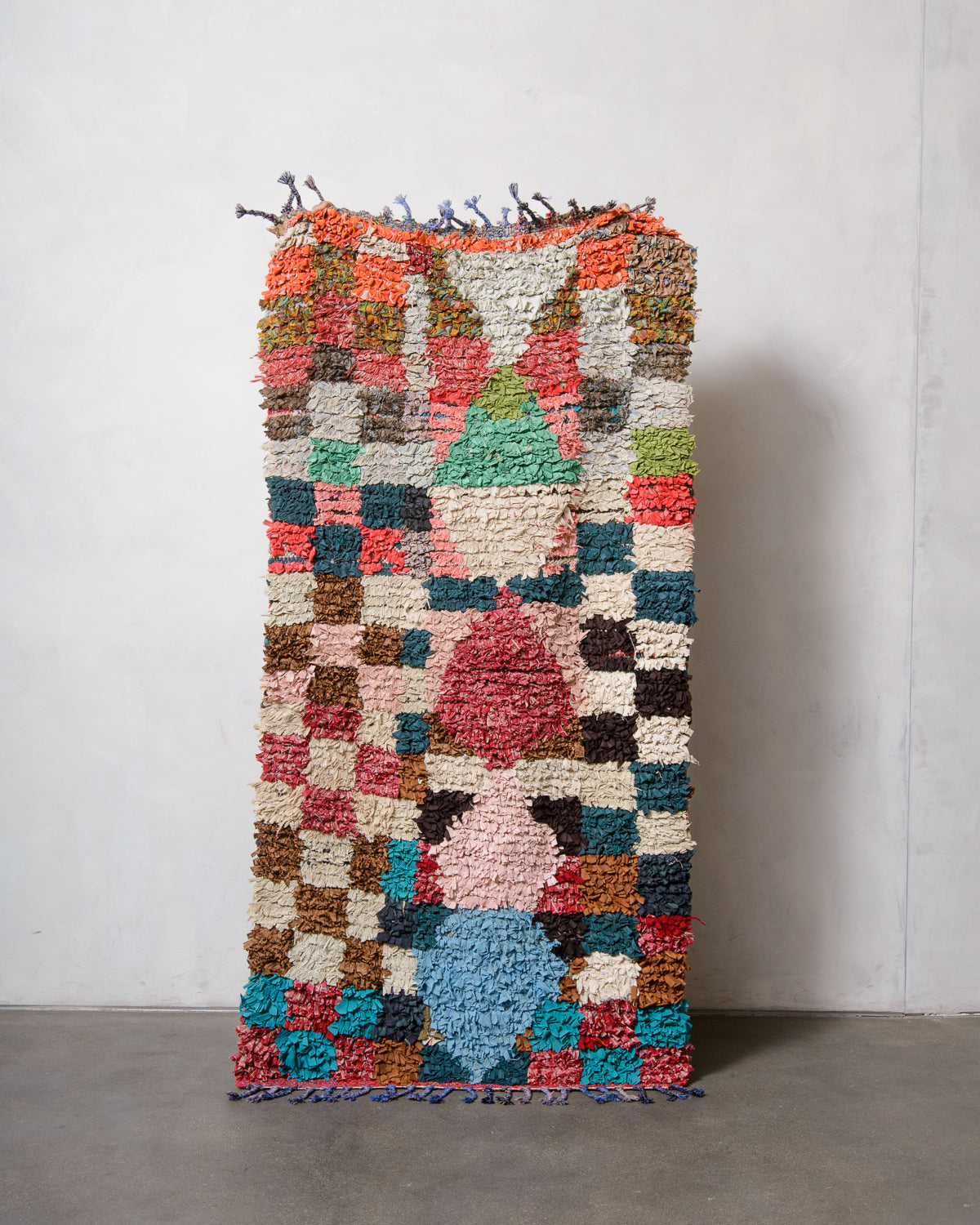 Modern designer vintage handcrafted Berber rug from Morocco. Boucherouite runner rug with beautiful colors and patterns.