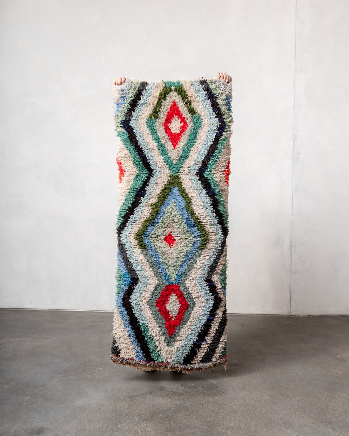 Modern designer vintage handcrafted Berber rug from Morocco. Boucherouite runner rug with beautiful colors and patterns.