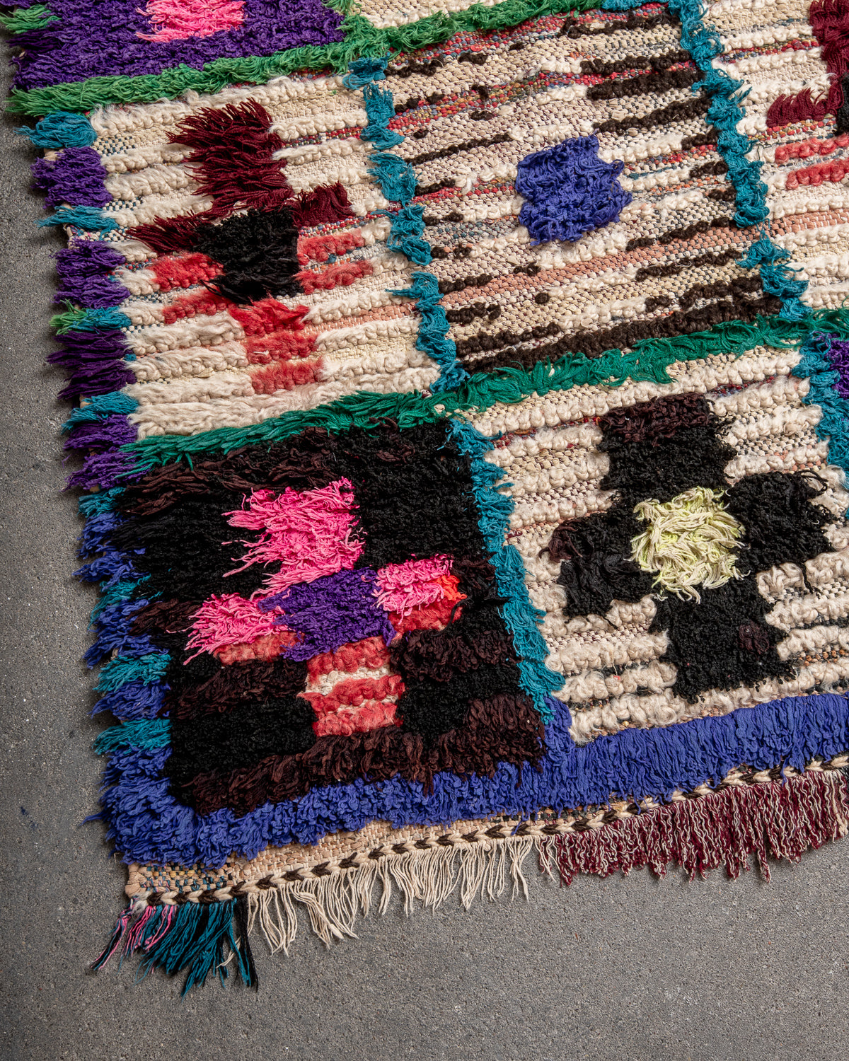 Modern designer vintage handcrafted Berber rug from Morocco. Boucherouite runner rug with beautiful colors and patterns.