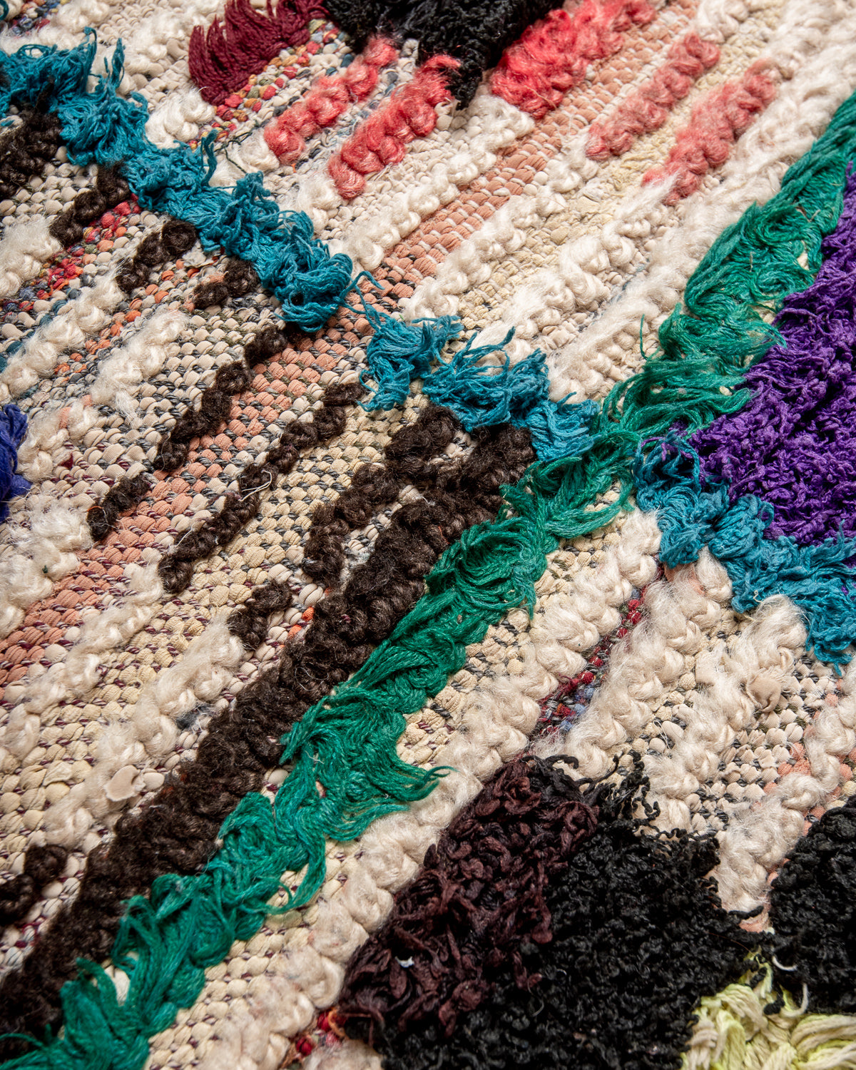 Modern designer vintage handcrafted Berber rug from Morocco. Boucherouite runner rug with beautiful colors and patterns.