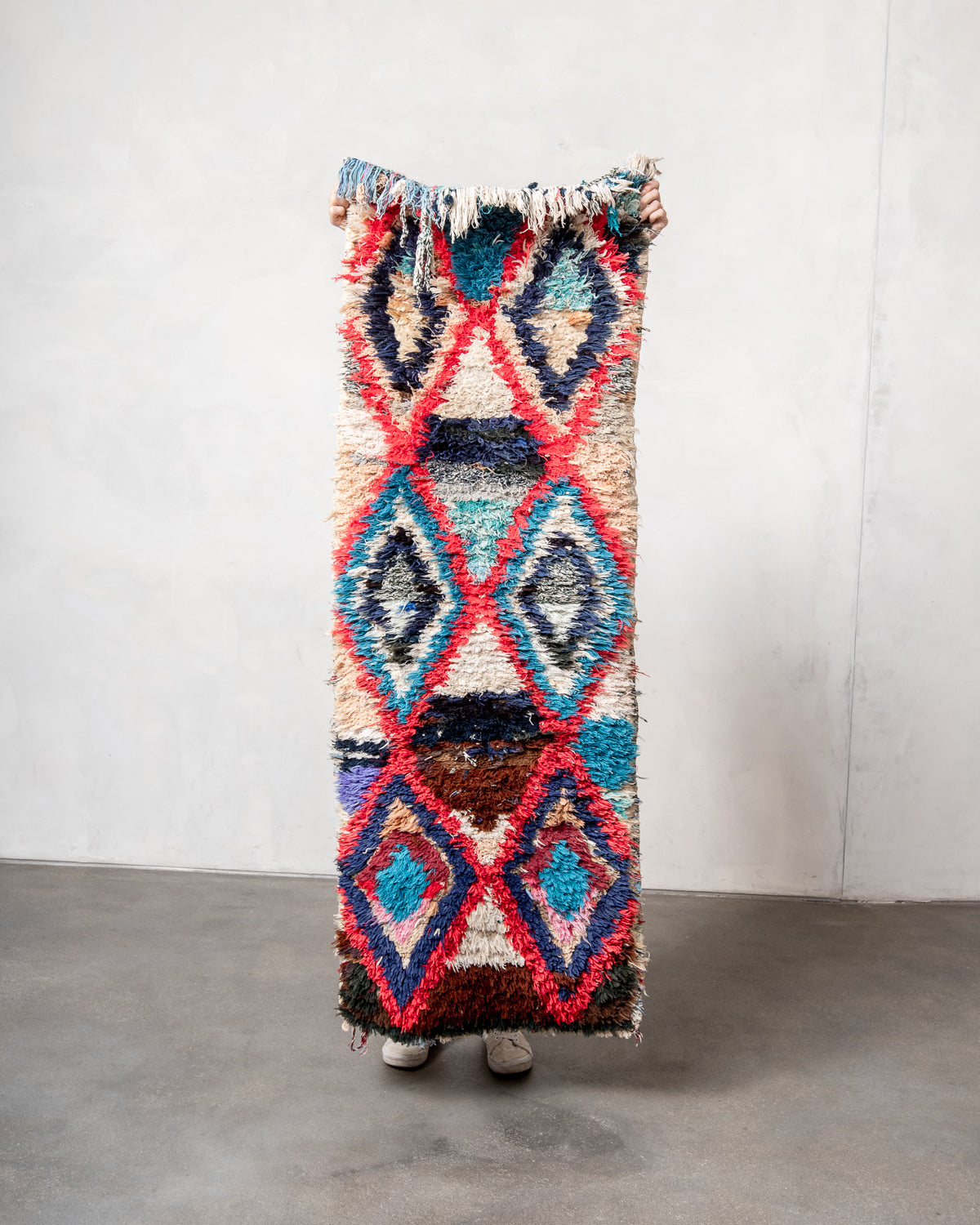 Modern designer vintage handcrafted Berber rug from Morocco. Boucherouite runner rug with beautiful colors and patterns.