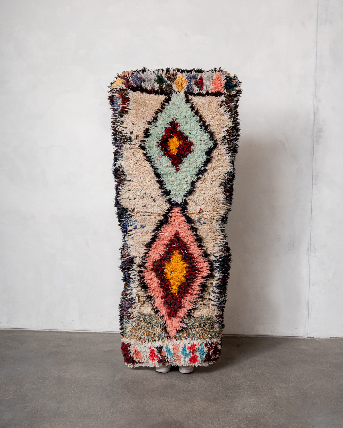 Modern designer vintage handcrafted Berber rug from Morocco. Boucherouite runner rug with beautiful colors and patterns.