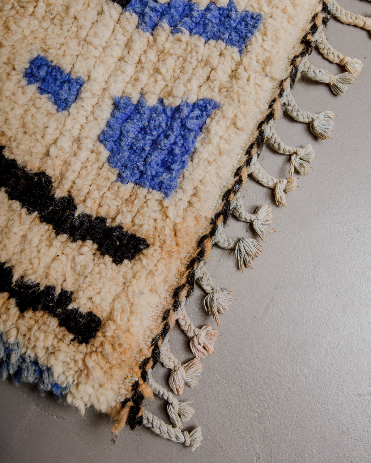 Corner of boujaad rug with cotton tassels