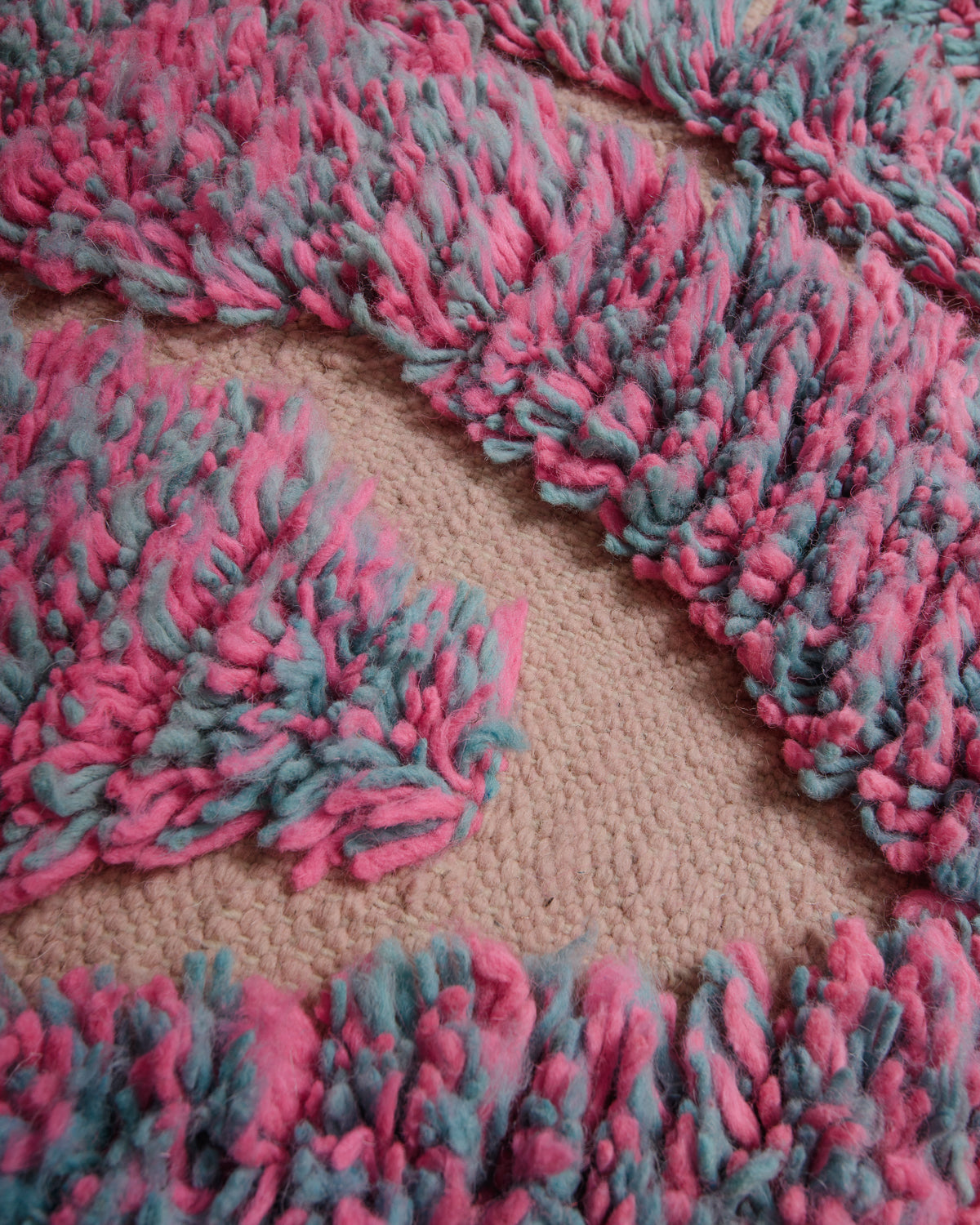 Close up of vintage boujaad rug showing length of pile and texture of woven areas.