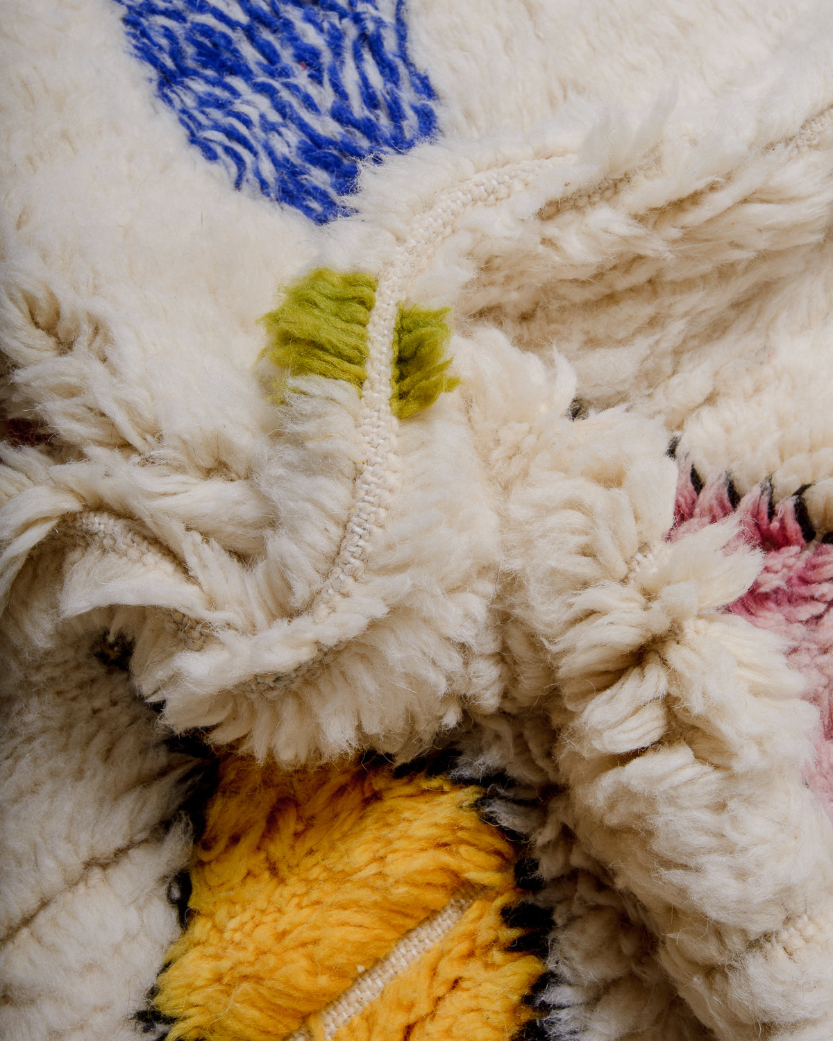 Detail of fluffy Azilal rug showing the spacing of the rows and the density of the wool pile.