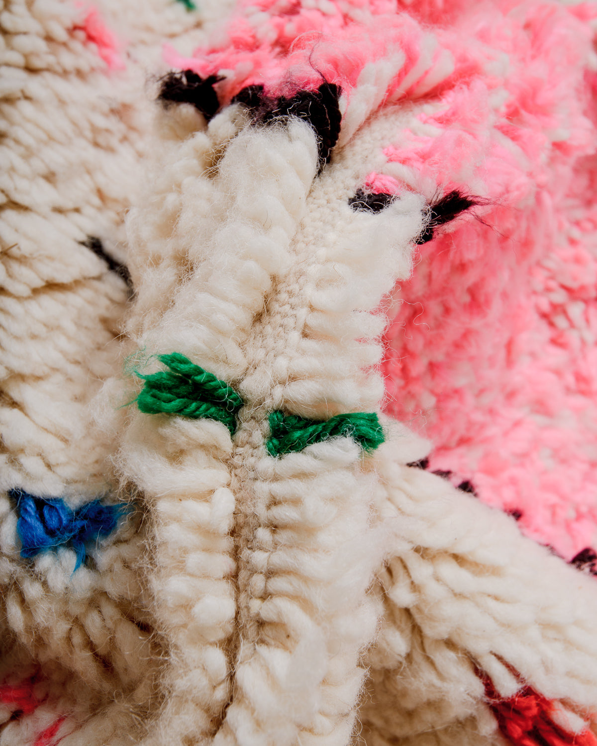 Close-up of a fluffy Azilal rug, showcasing the intricate spacing of the rows and the dense wool pile texture.