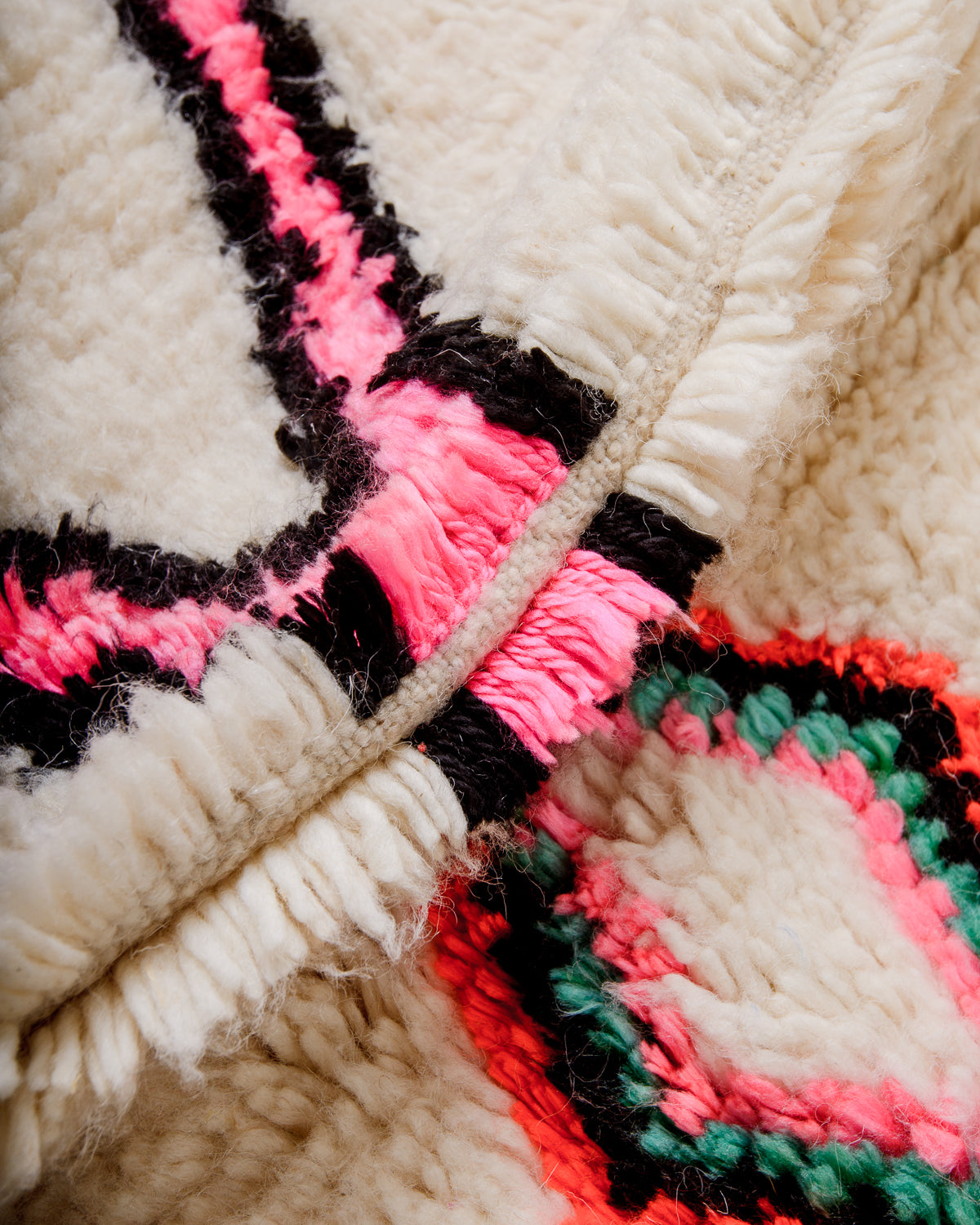 Close-up of a fluffy Azilal rug, showcasing the intricate spacing of the rows and the dense wool pile texture.