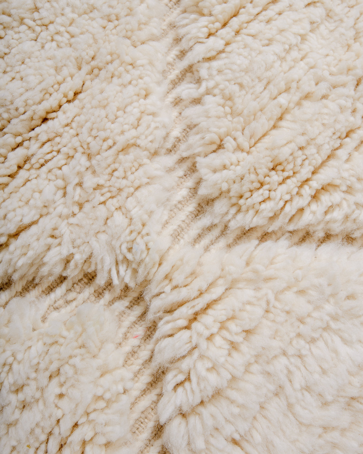 Detail of wool Berber rug showing woven design.