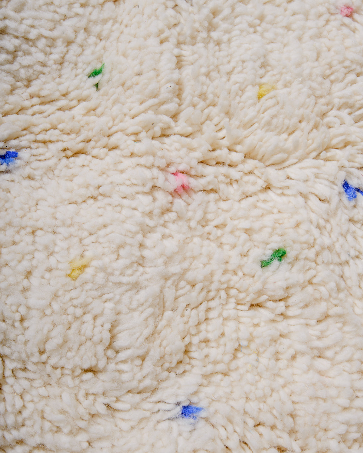 Detail view of Beniourain Rug showing its colourful dots.
