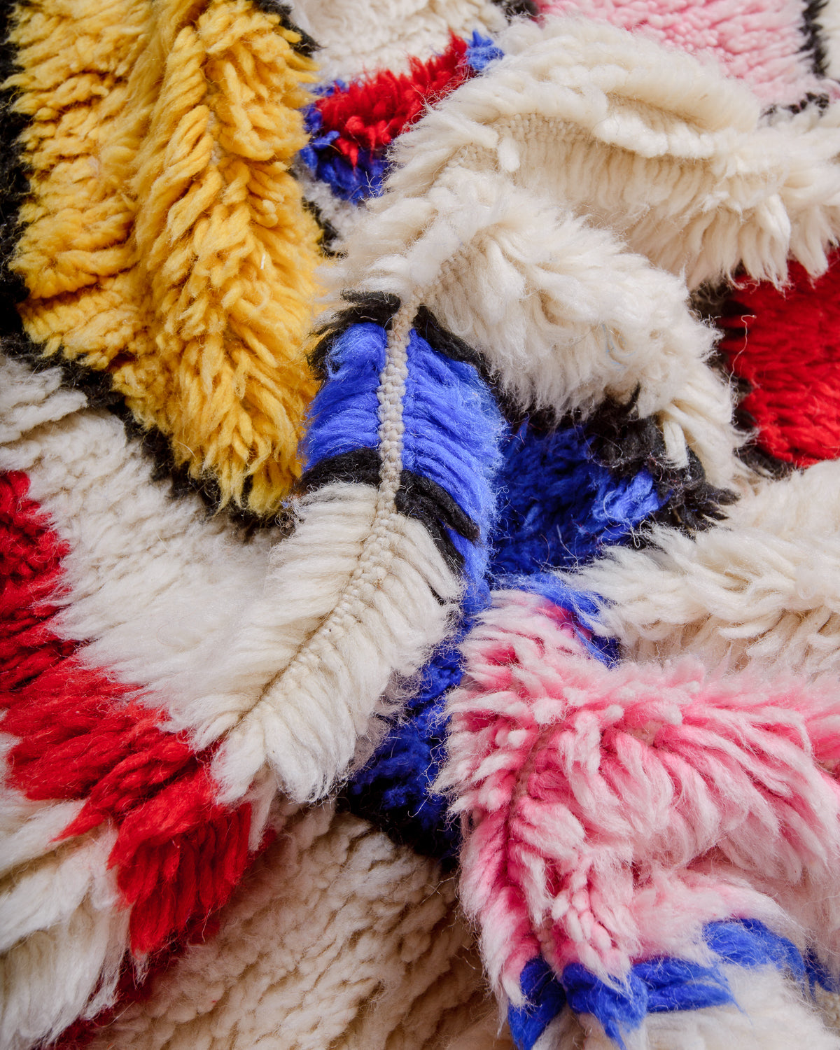 Detail of Berberlin finest rug showing fluffy wool pile and dense knots.