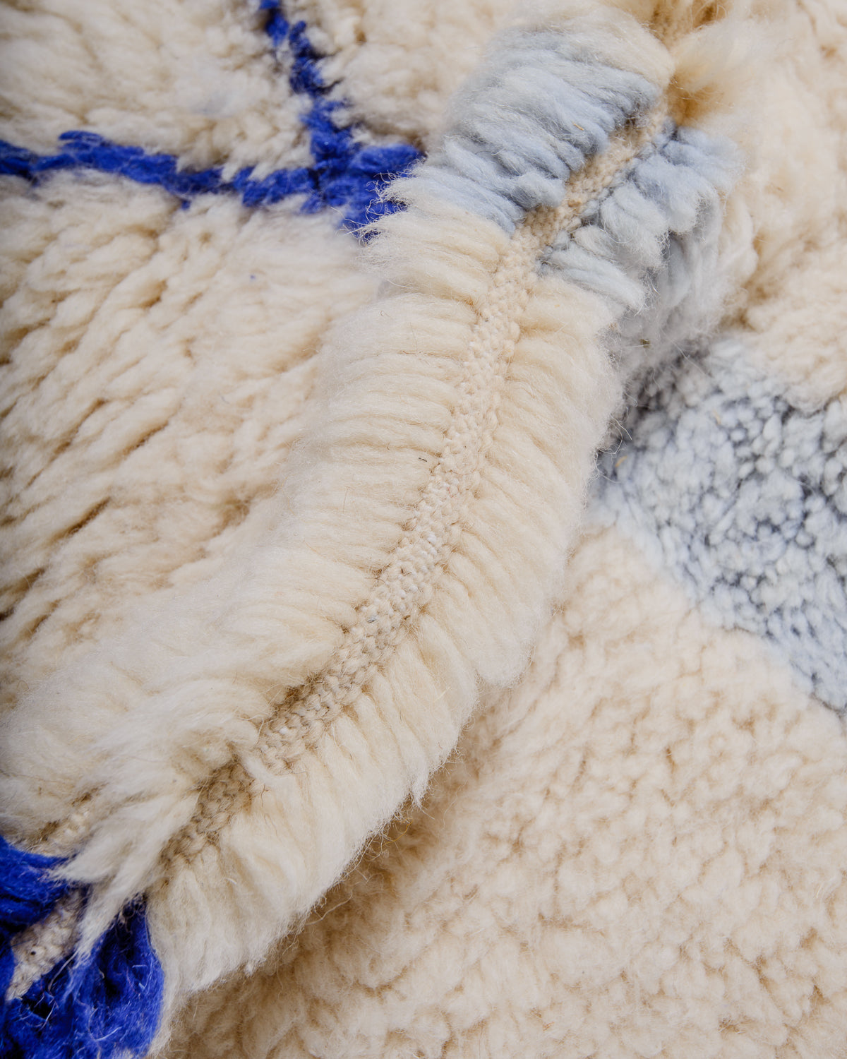 Detail of Berberlin finest rug showing fluffy wool pile and dense knots.