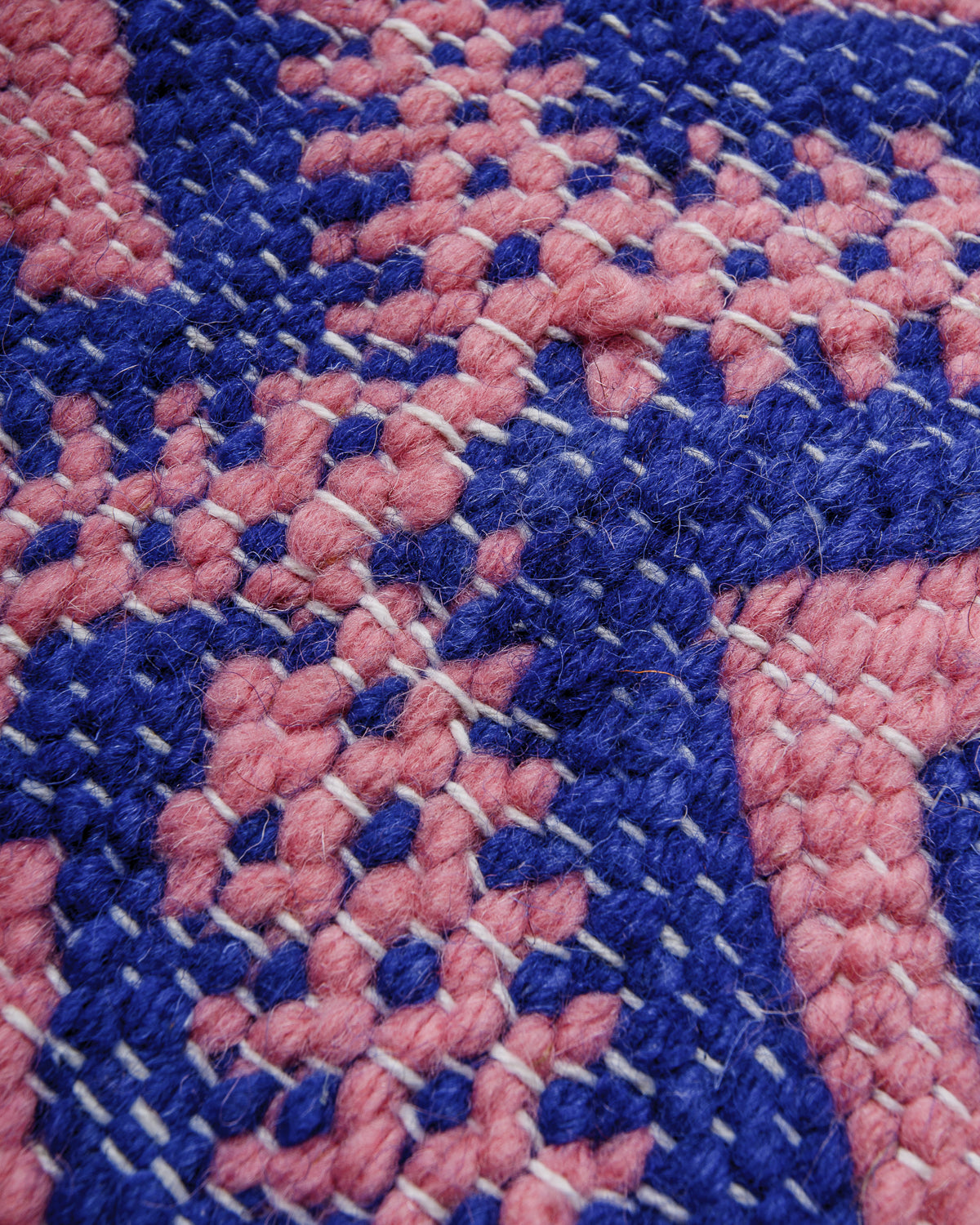 Blue and pink flat-woven kelim rug showing the detailed texture of the weave.