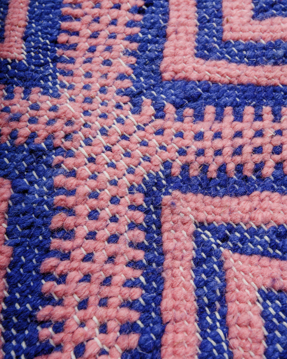 Detail of texture of flat-woven wool of a Kelim rug.