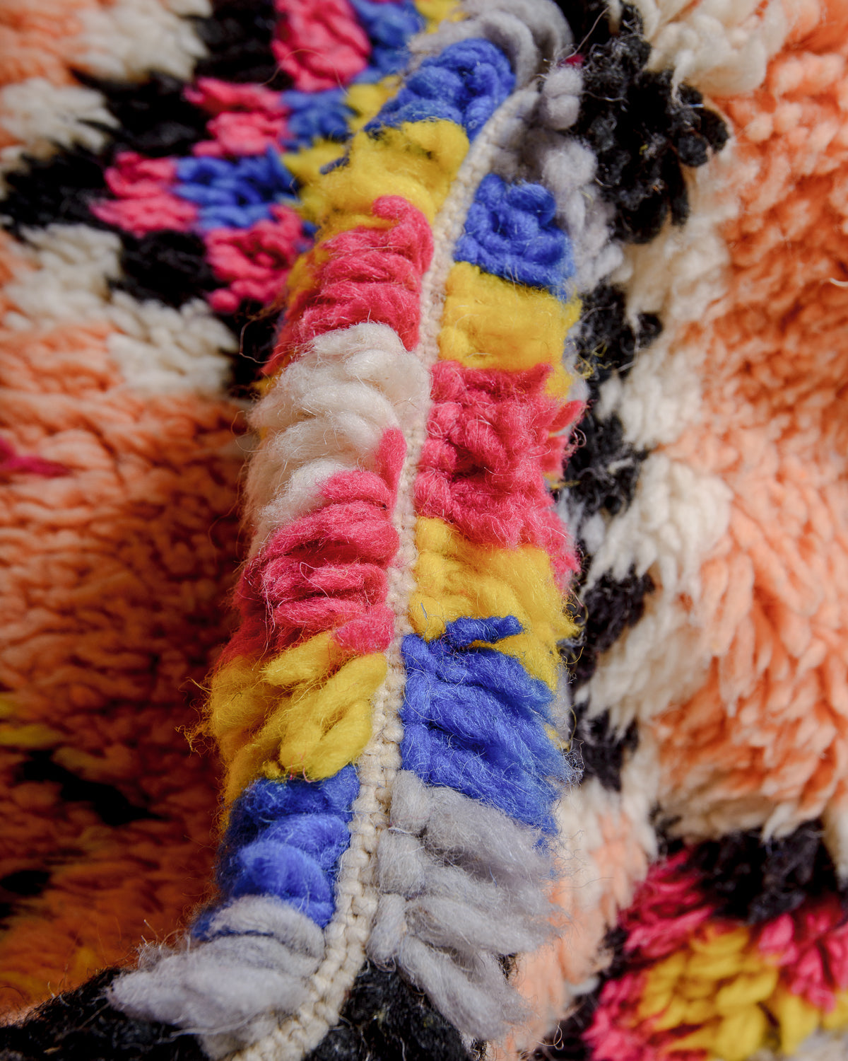 Detail of colourful fluffy wool pile on Berberlin runner rug.