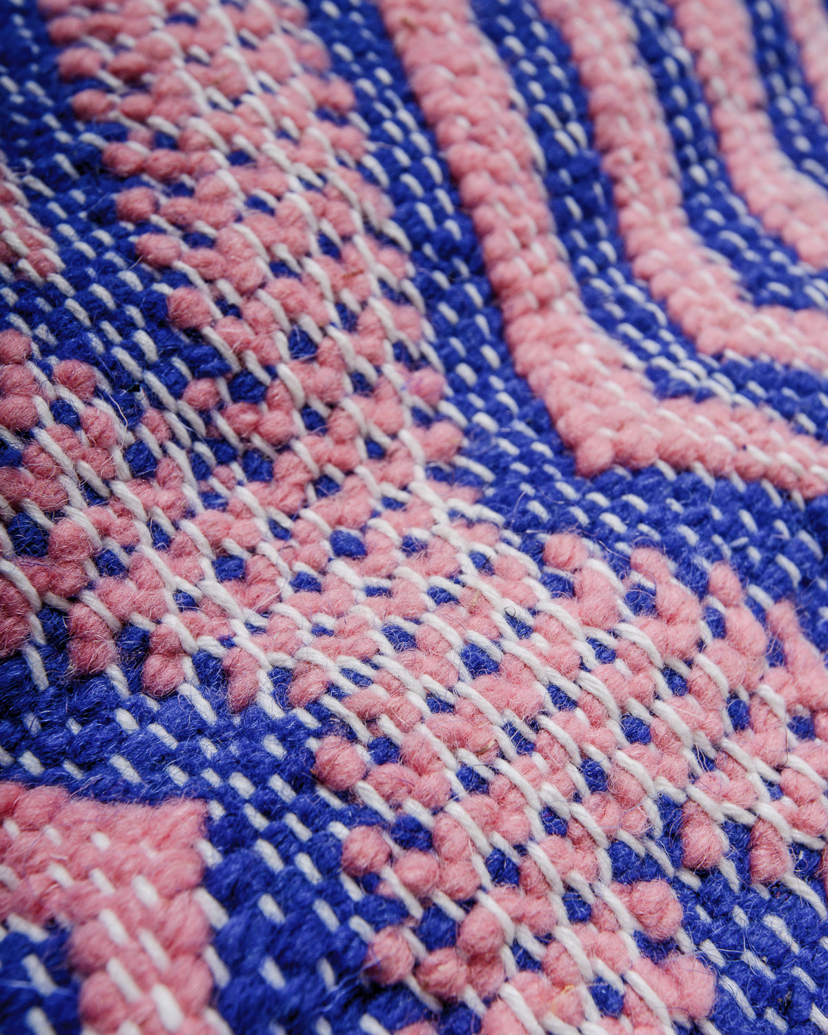 Detail of texture of flat-woven wool of a Kelim rug.