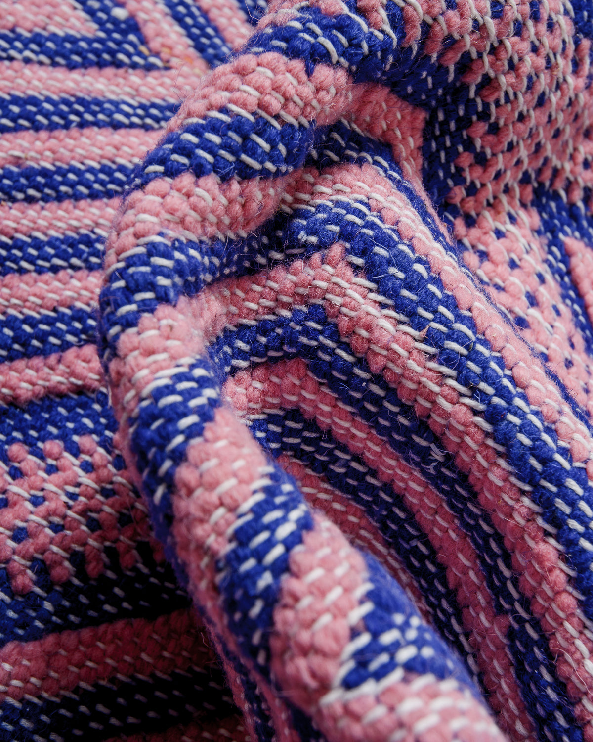 Detail of texture of flat-woven wool of a Kelim rug.