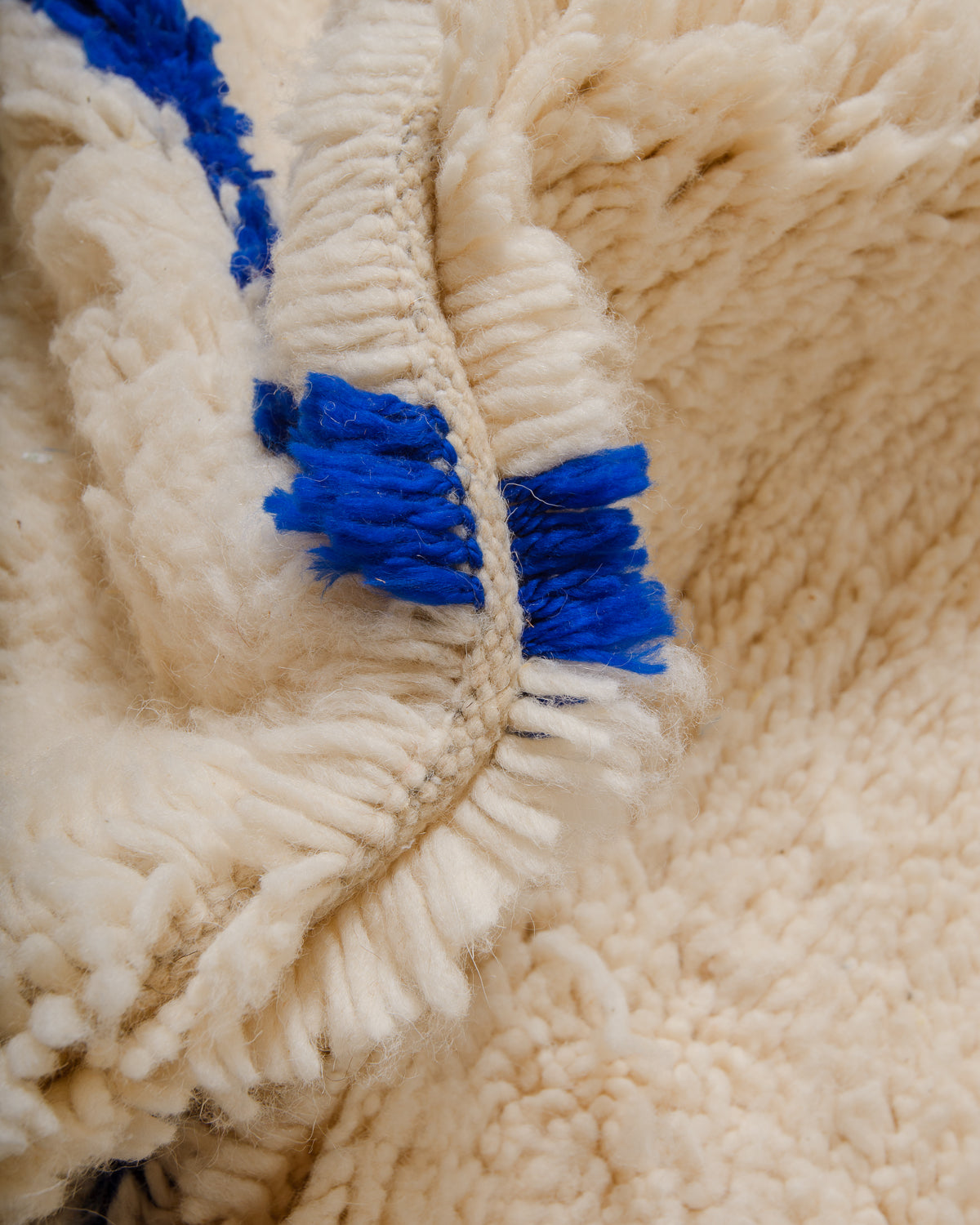 Detail of Azilal rug showing the fluffy wool, soft cotton and the spacing between the rows.