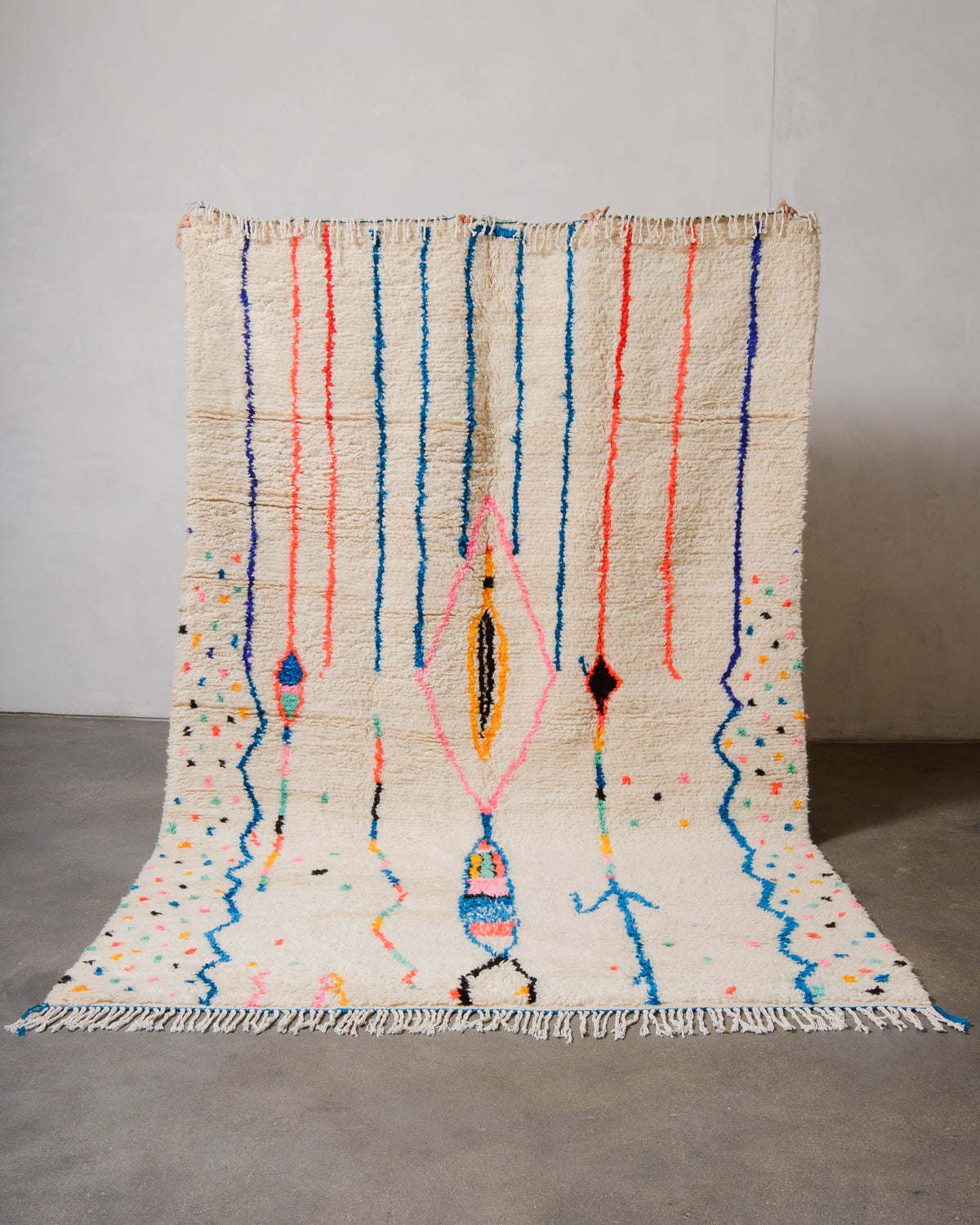 Berberlin Azilal rug with colorful lines and dots on a plain background