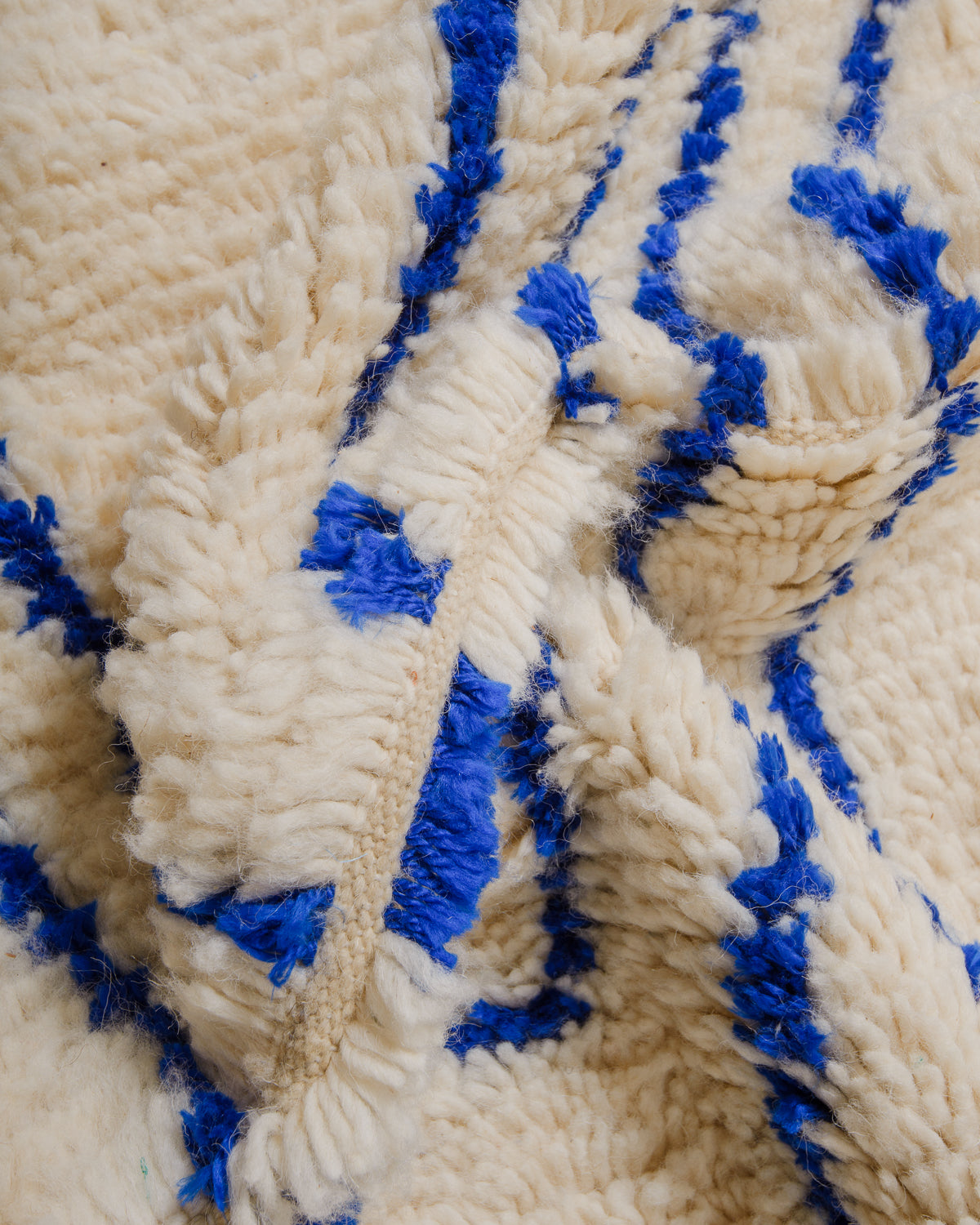 Close-up of Azilal rug showing the fluffy wool and the spacing between the rows.