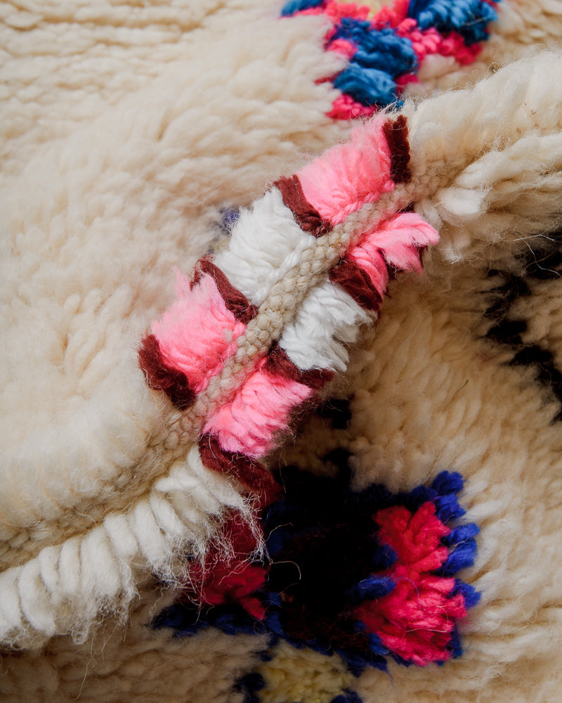 Close up of Berberlin Azilal rug with cream sheep's wool and colourful cotton.