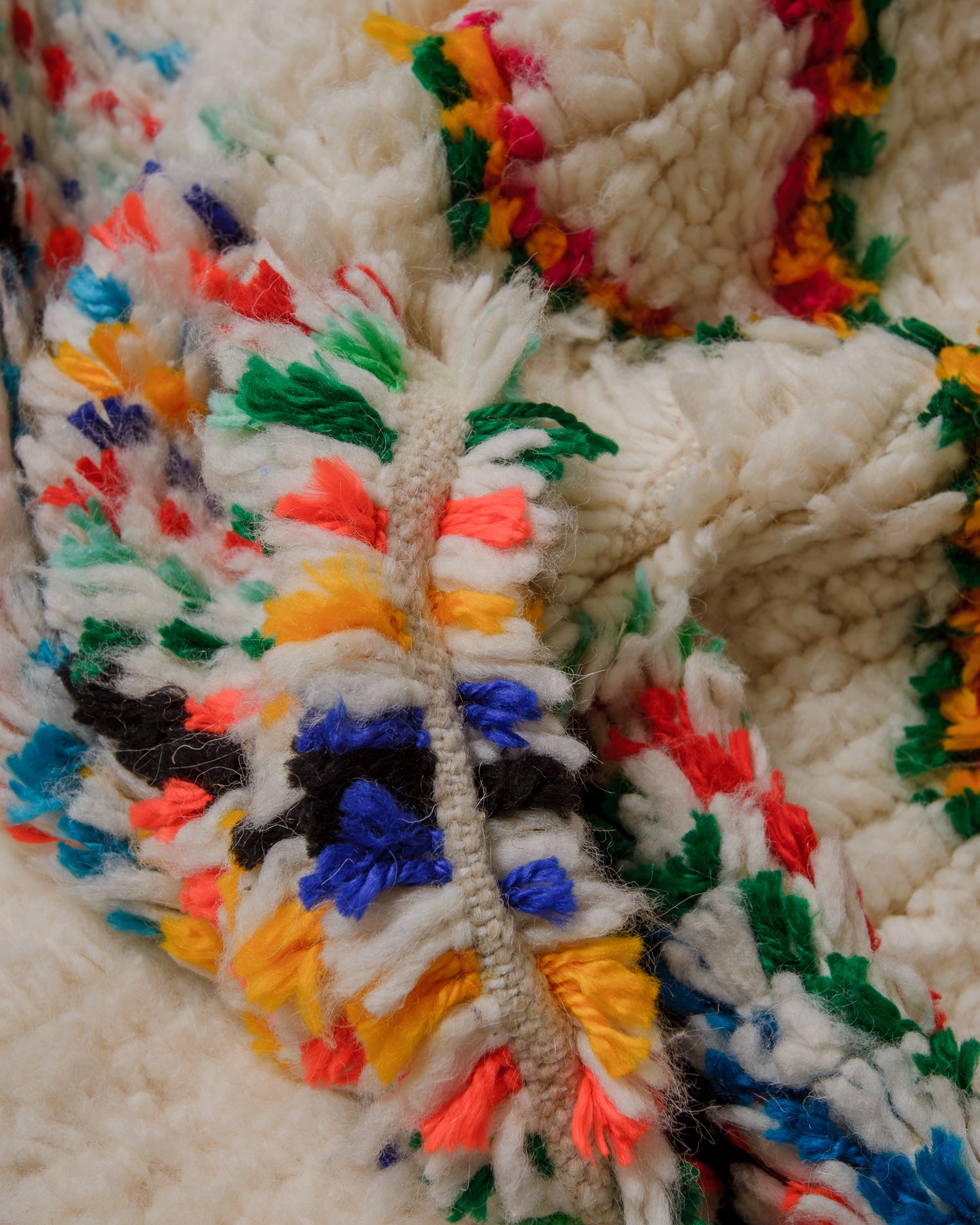 Close up of azilal rug with fluffy texture and confetti colours.