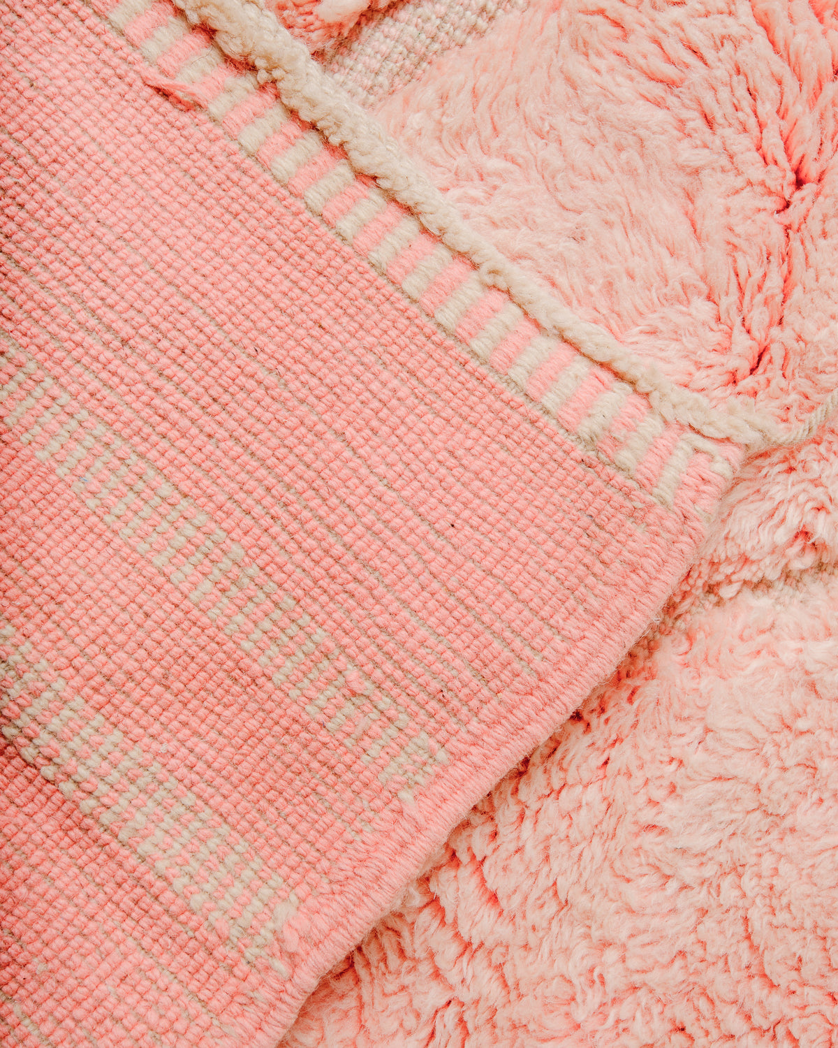 Corner of rug folded over showing the density of the rows of knots that make a Beni M'rirt.