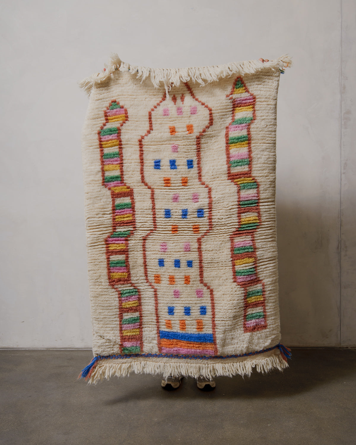 Decorative rug with colorful patterns on a plain background