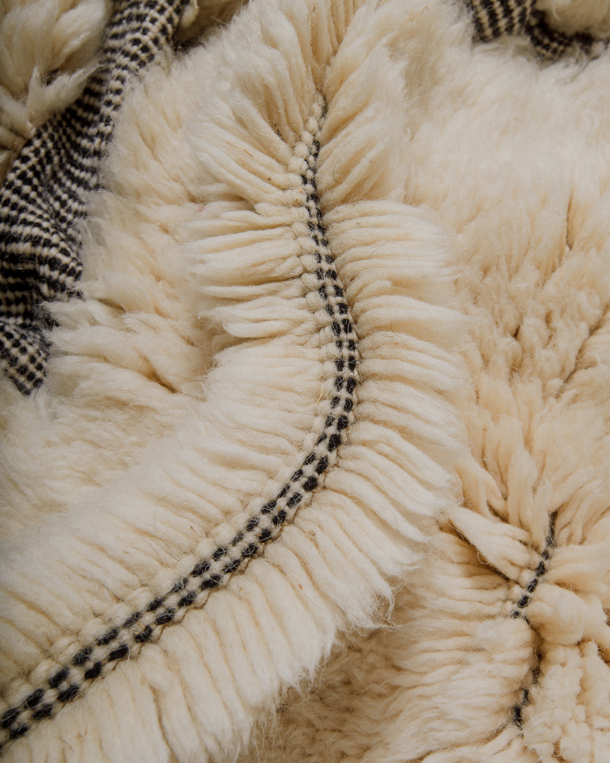 Close up of knots and dense pile of Berberlin Finest Mrirt rug.