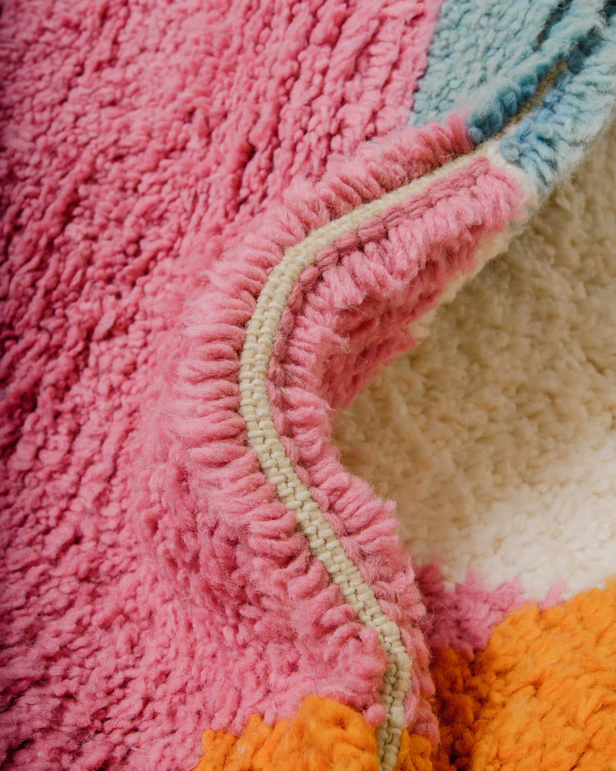 Close up of colourful, fluffy wool rug.