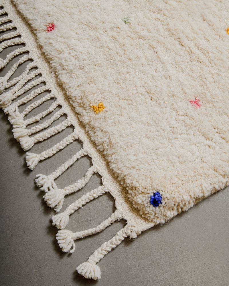 Edge of Berberlin finest rug with natural wool tassels. 