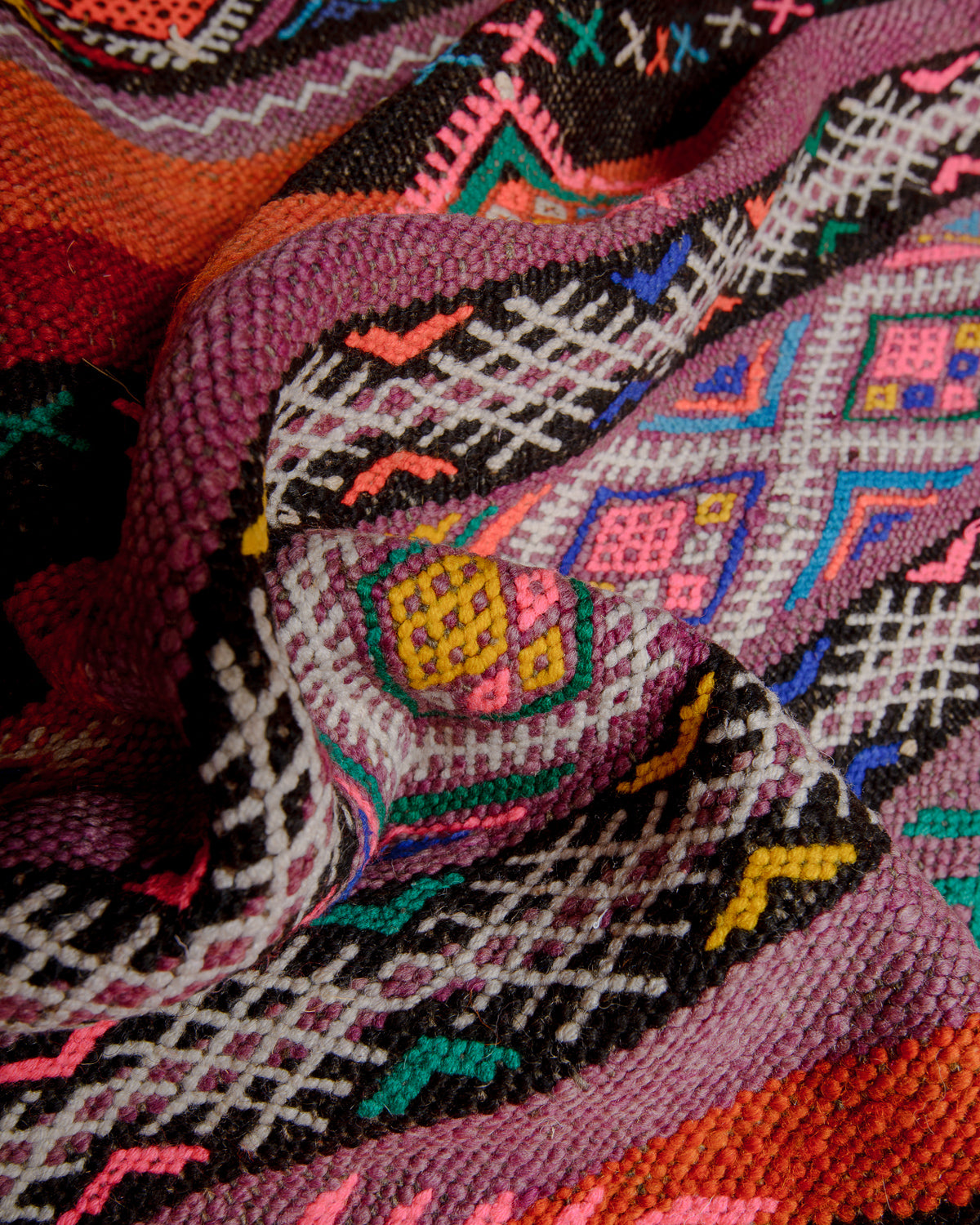 Close up showing all the details of this colourful flat woven kelim rug.