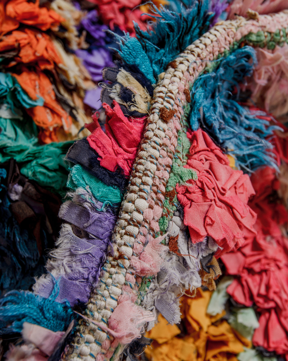 Close up of boucherouite rug made of recycled fabric scraps. 
