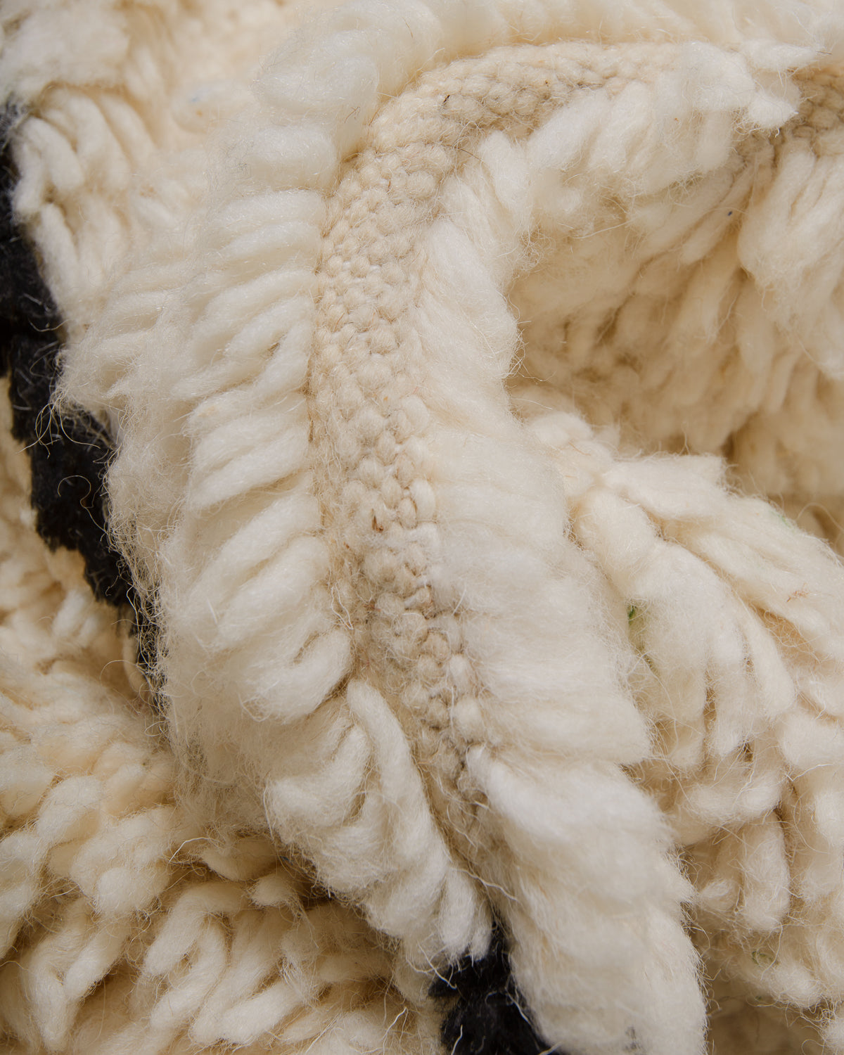 Detail of Azilal rug showing the fluffy wool, soft cotton and the spacing between the rows.