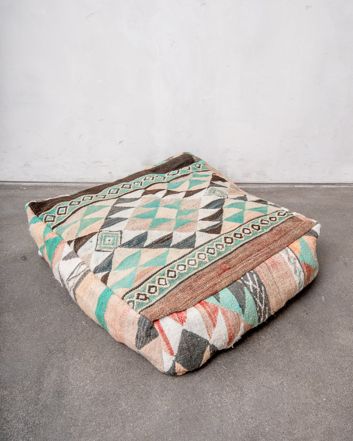 Vintage, handcrafted Berber floor cushion from Morocco. Kelim pouf with beautiful designs and robust flat weave. 100% wool.