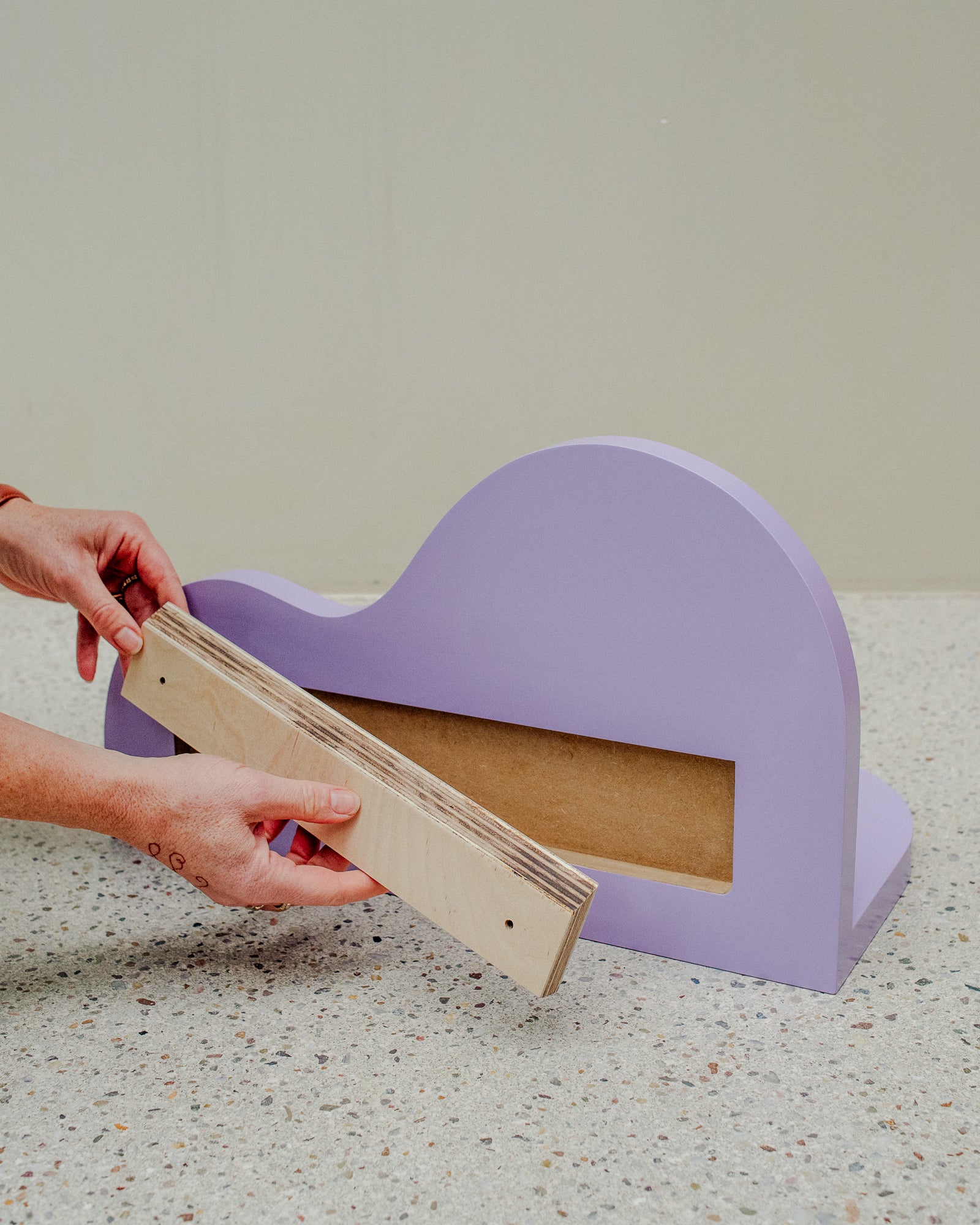 Small, curvy wall shelf in the colour Lavendula. Designed by Berberlin Rugs and handmade in Berlin by Nicolene van Der Walt.