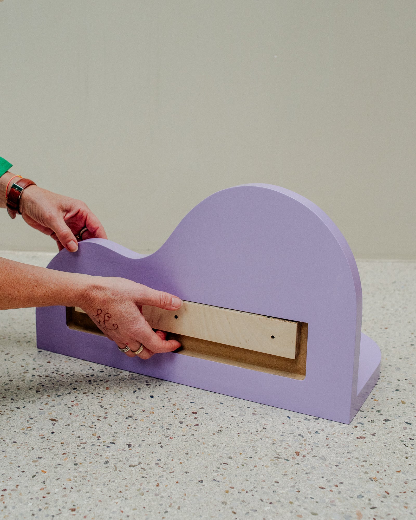 Small, curvy wall shelf in the colour Lavendula. Designed by Berberlin Rugs and handmade in Berlin by Nicolene van Der Walt.