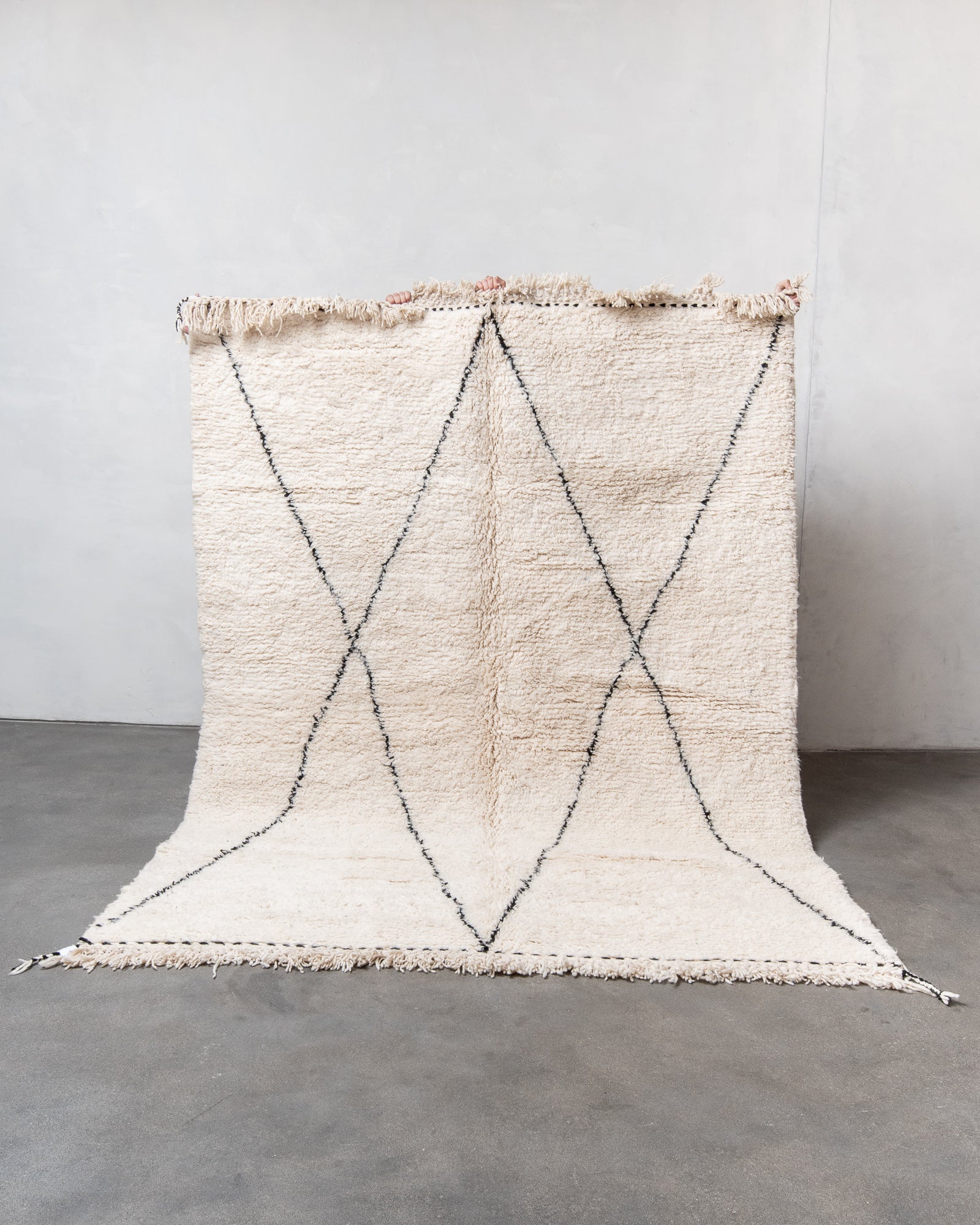 Modern, designer, handcrafted Berber rug from Morocco. Beniourain carpet with minimalist design, natural wool pile and a fluffy texture.