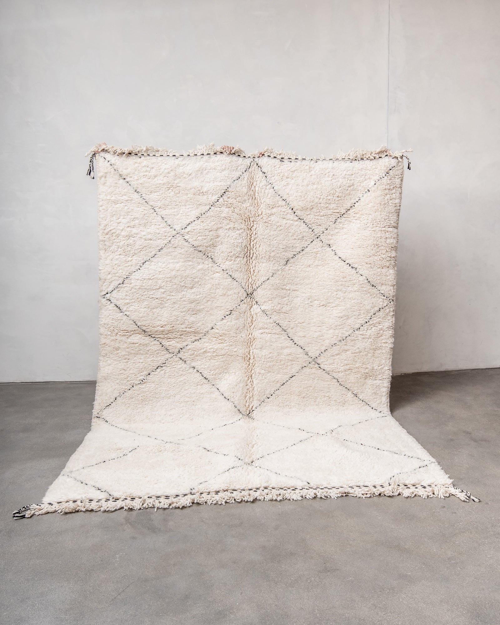 Modern, designer, handcrafted Berber rug from Morocco. Beniourain carpet with minimalist design, natural wool pile and a fluffy texture.