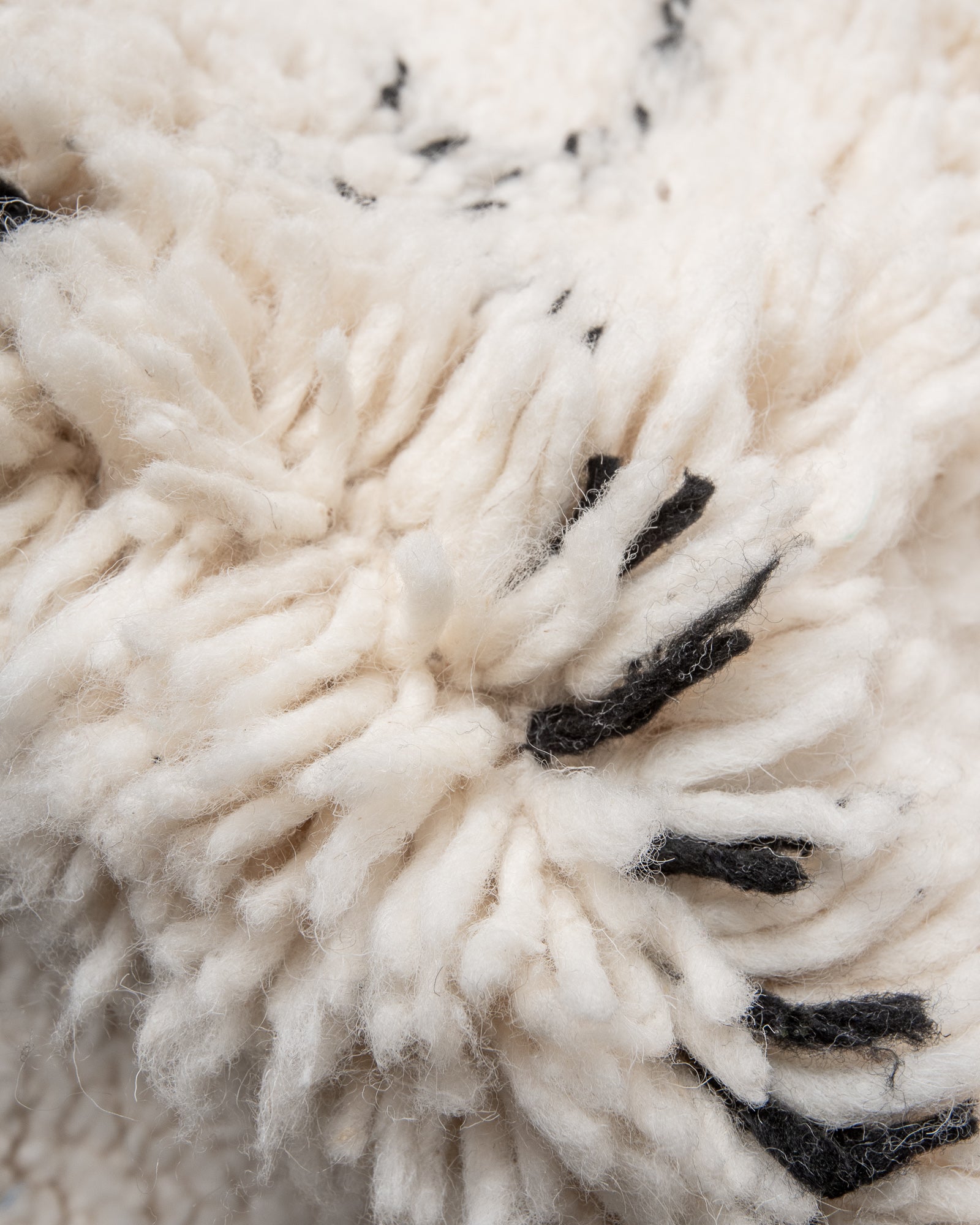 Modern, designer, handcrafted Berber rug from Morocco. Beniourain carpet with minimalist design, natural wool pile and a fluffy texture.