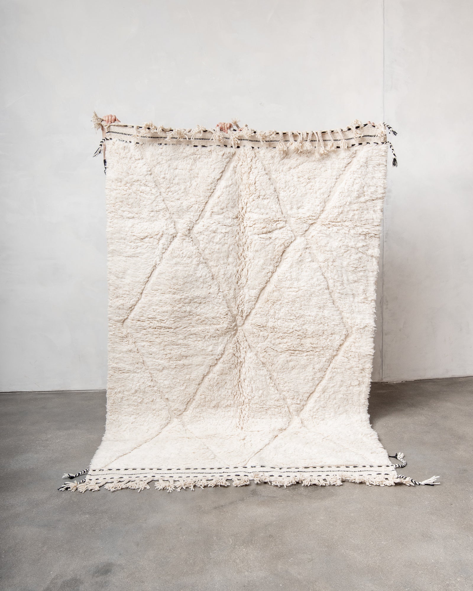 Modern, designer, handcrafted Berber rug from Morocco. Beniourain carpet with minimalist design, natural wool pile and a fluffy texture.