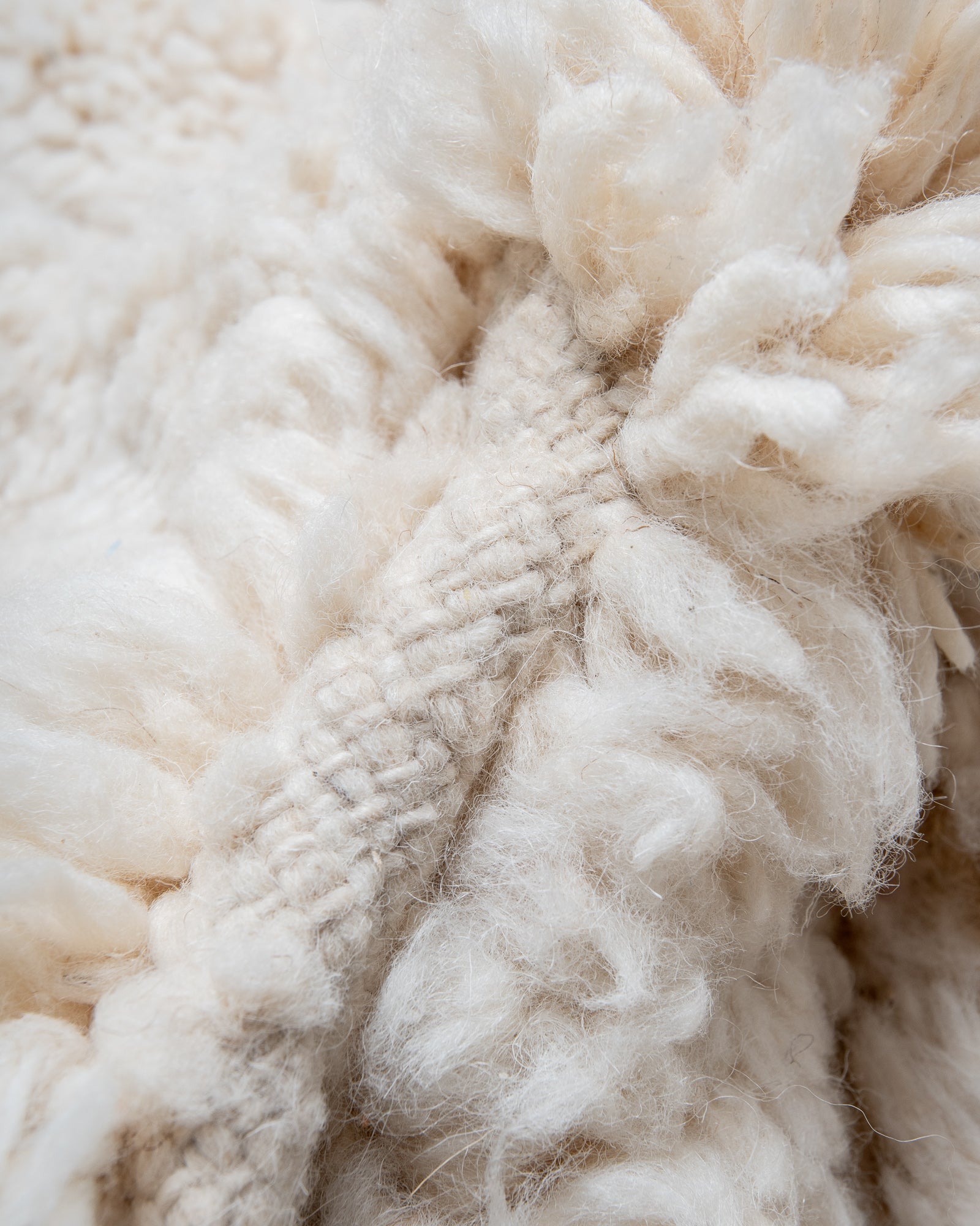 Modern, designer, handcrafted Berber rug from Morocco. Beniourain carpet with minimalist design, natural wool pile and a fluffy texture.