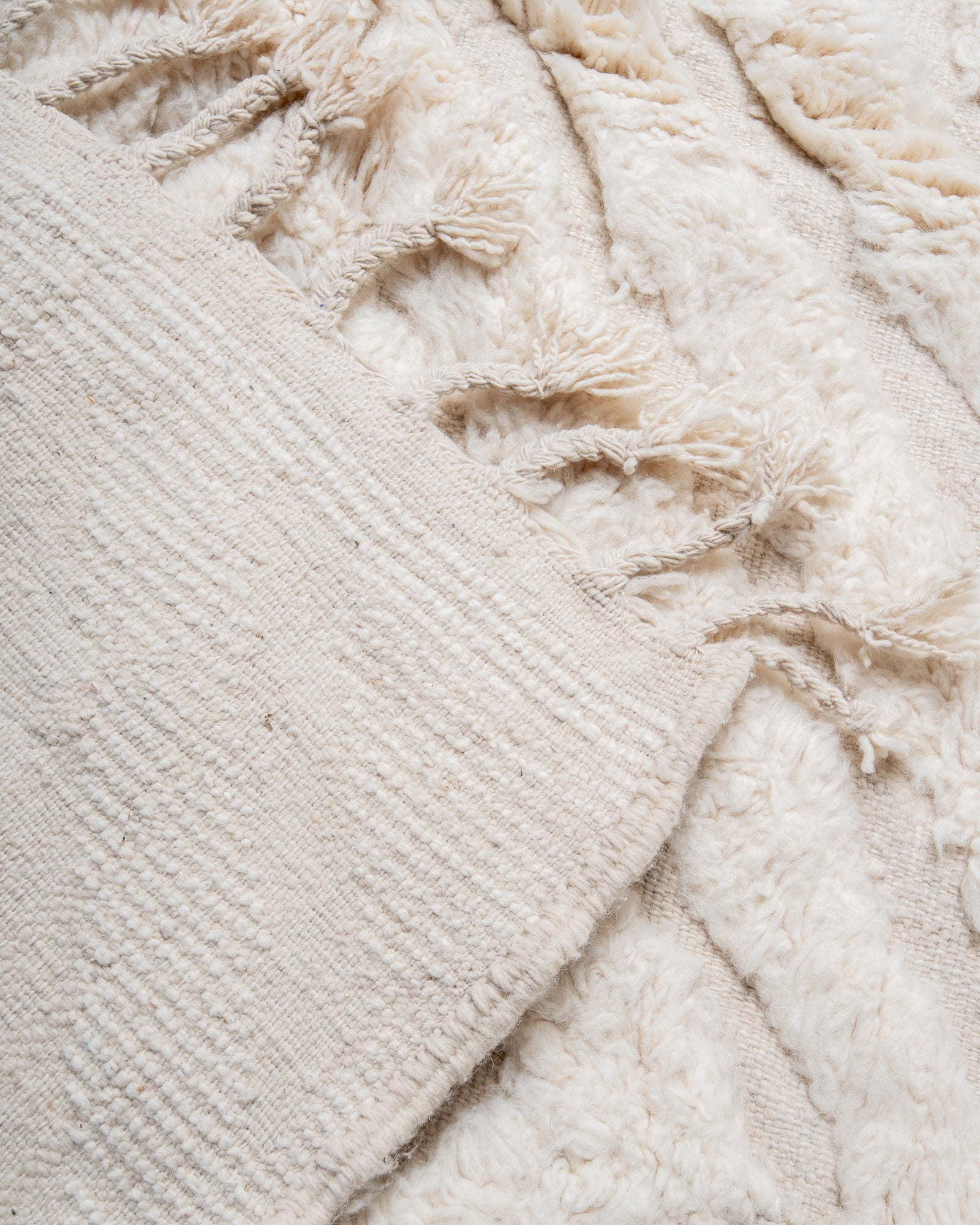 Modern, designer, handcrafted Berber rug from Morocco. Beniourain carpet with minimalist design, natural wool pile and a fluffy texture.