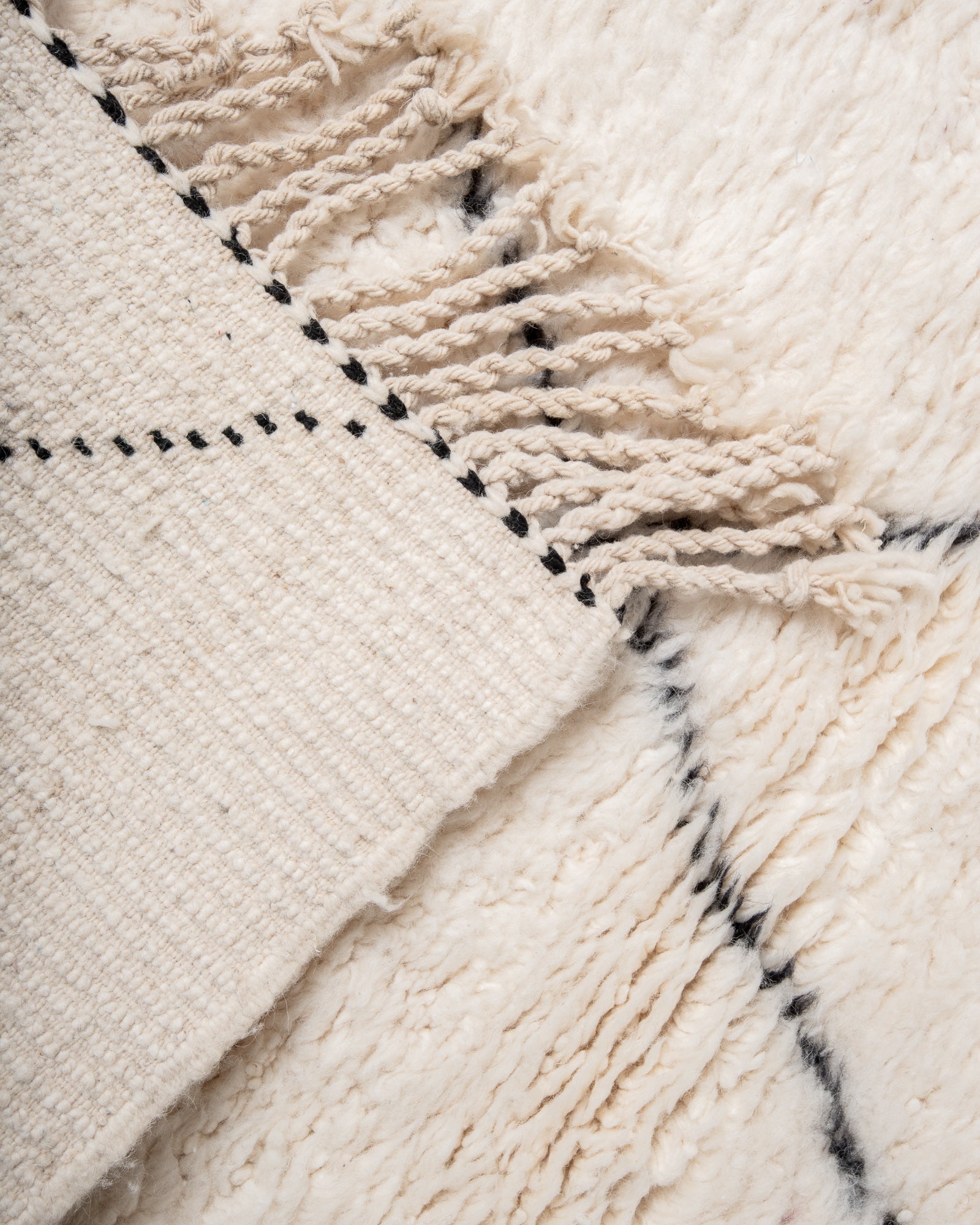 Modern, designer, handcrafted Berber rug from Morocco. Beniourain carpet with minimalist design, natural wool pile and a fluffy texture.