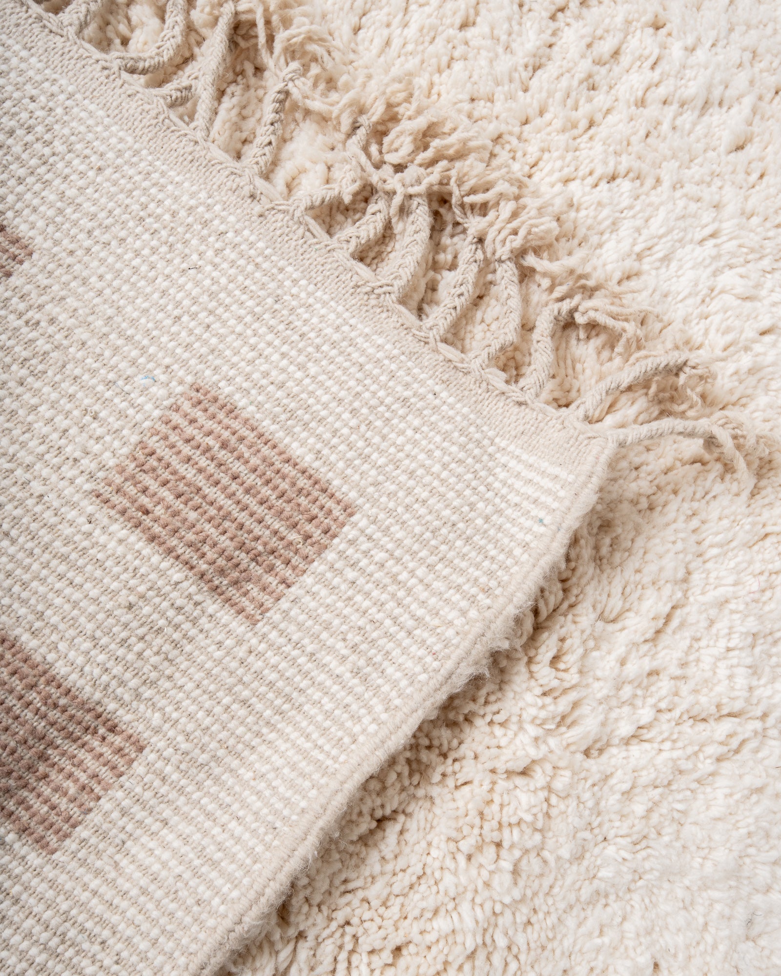 Modern, designer, handcrafted Berber rug from Morocco. Beniourain carpet with beautiful colours and patterns and fluffy wool texture.