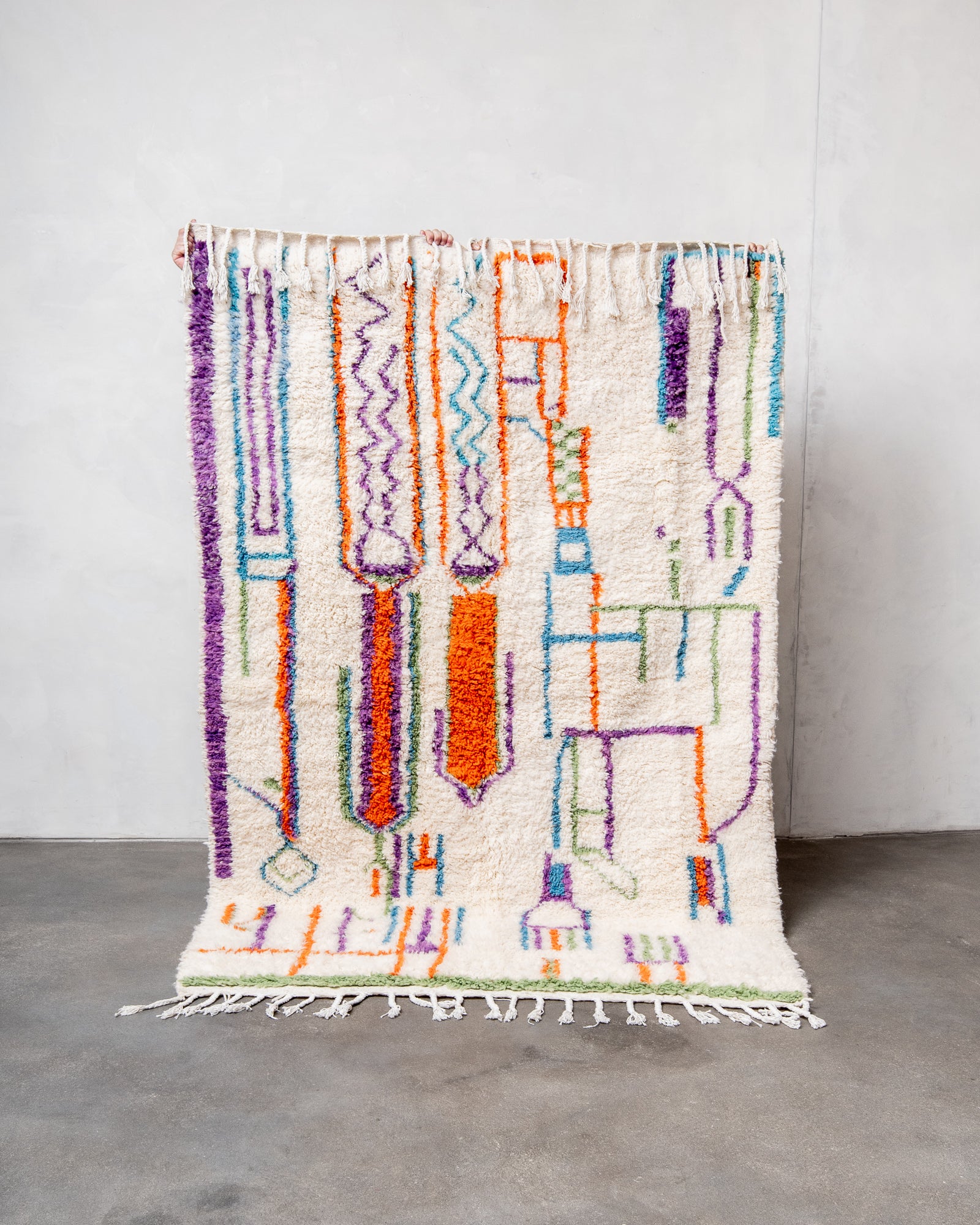 Modern, designer, handcrafted Berber rug from Morocco. Beniourain carpet with beautiful colours and patterns and fluffy wool texture.