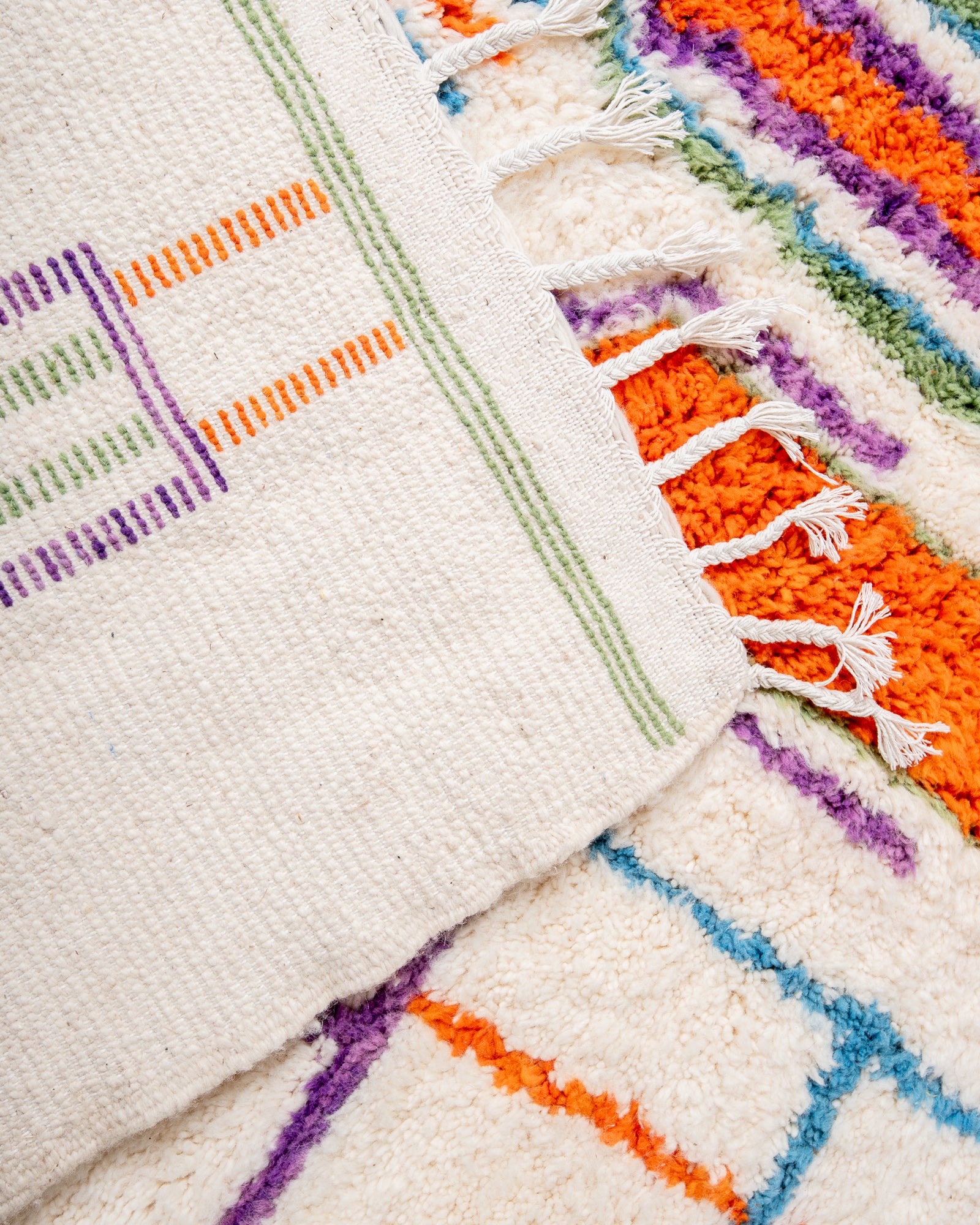 Modern, designer, handcrafted Berber rug from Morocco. Beniourain carpet with beautiful colours and patterns and fluffy wool texture.