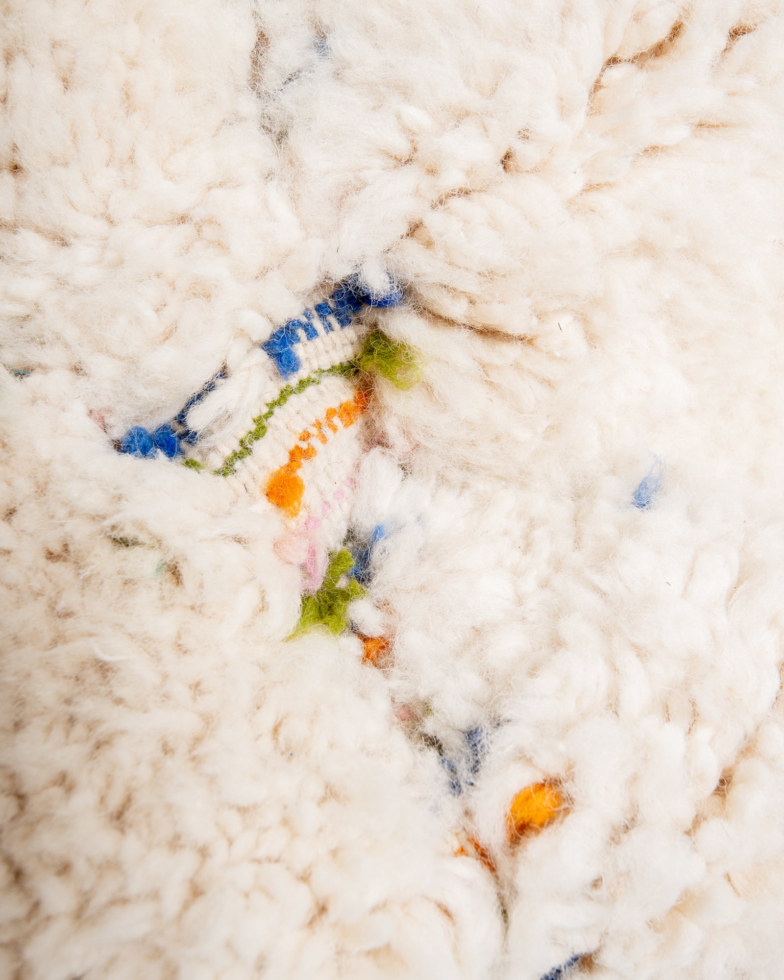 Modern, designer, handcrafted Berber rug from Morocco. Beniourain carpet with beautiful colours and patterns and fluffy wool texture.