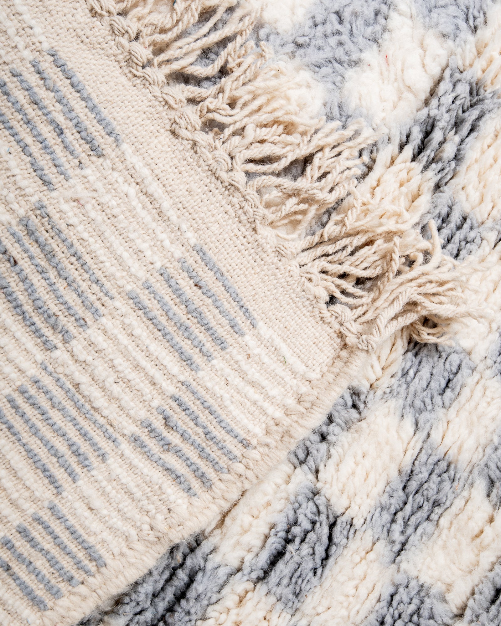 Modern, designer, handcrafted Berber rug from Morocco. Beniourain carpet with beautiful colours and patterns and fluffy wool texture.